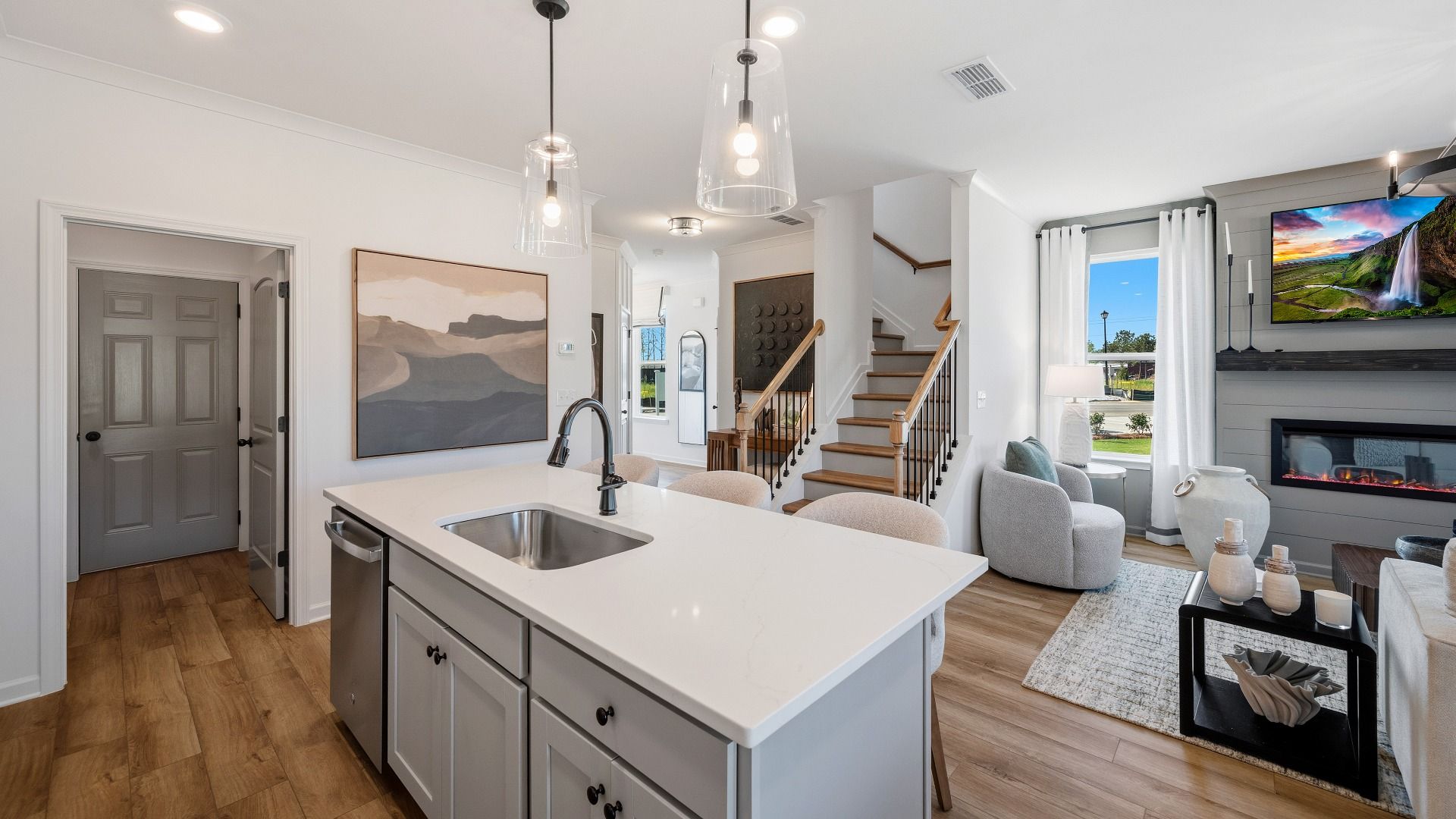 Kitchen space with view into the gathering room and access to staircase