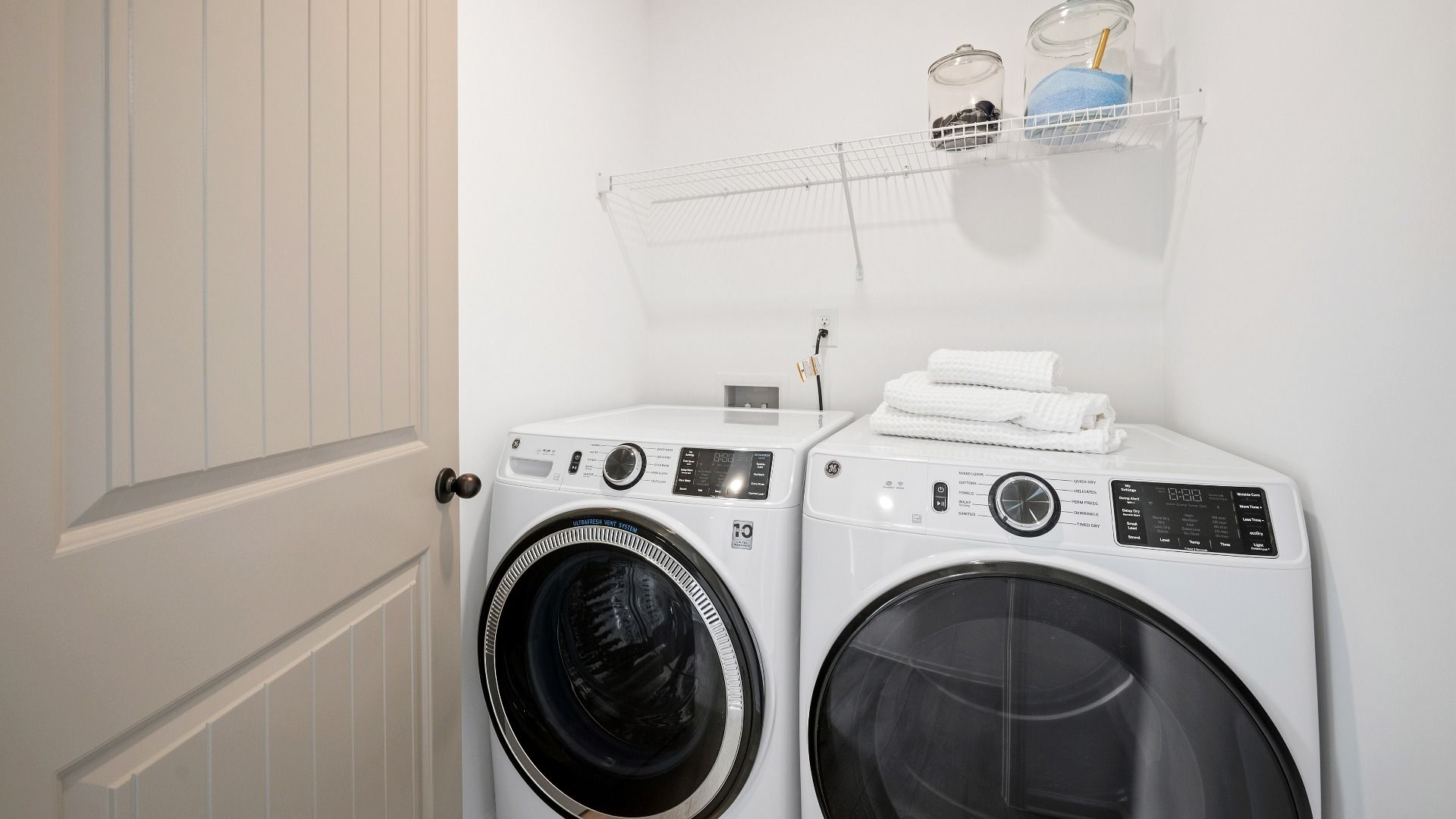 Dedicated laundry space with ventilated shelf