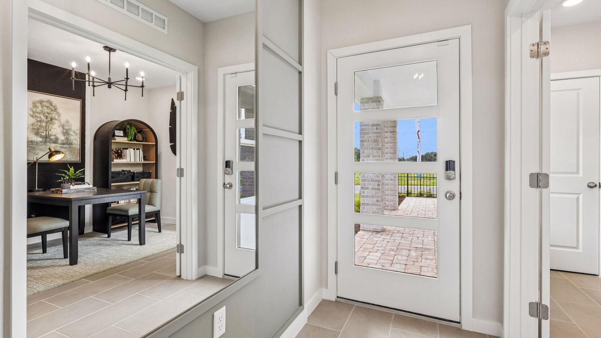 Flagler Floor Plan in Modern Elevation Door with a flex space staged as a study to the left of entry