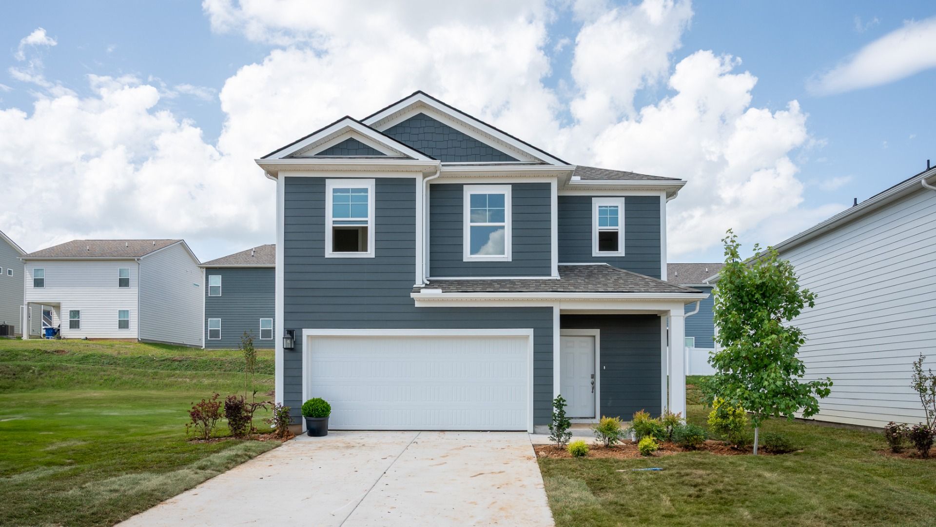 Blue exterior with 2-car garage