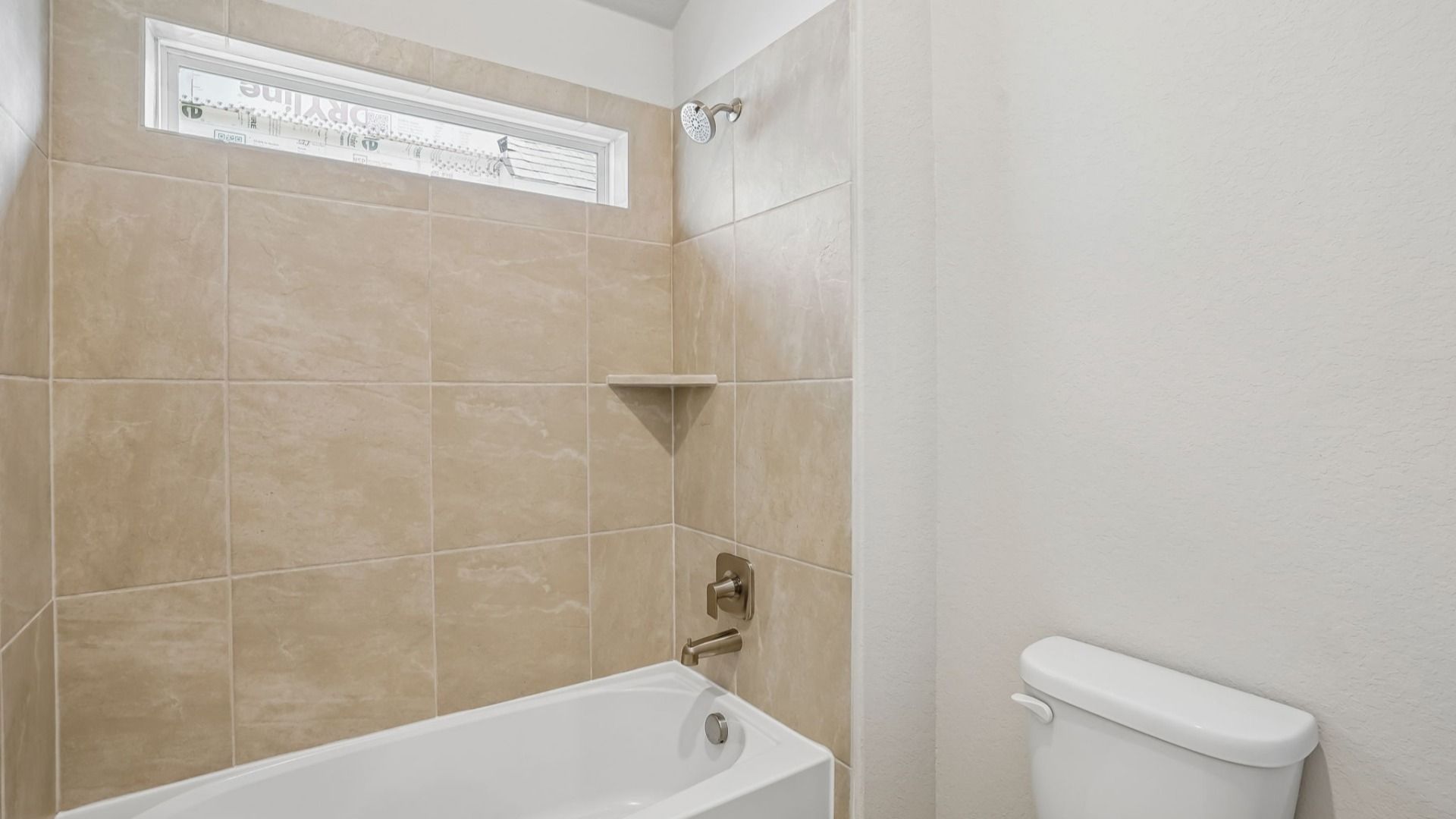 Secondary Bathroom with window at shower/tub combo for natural light
