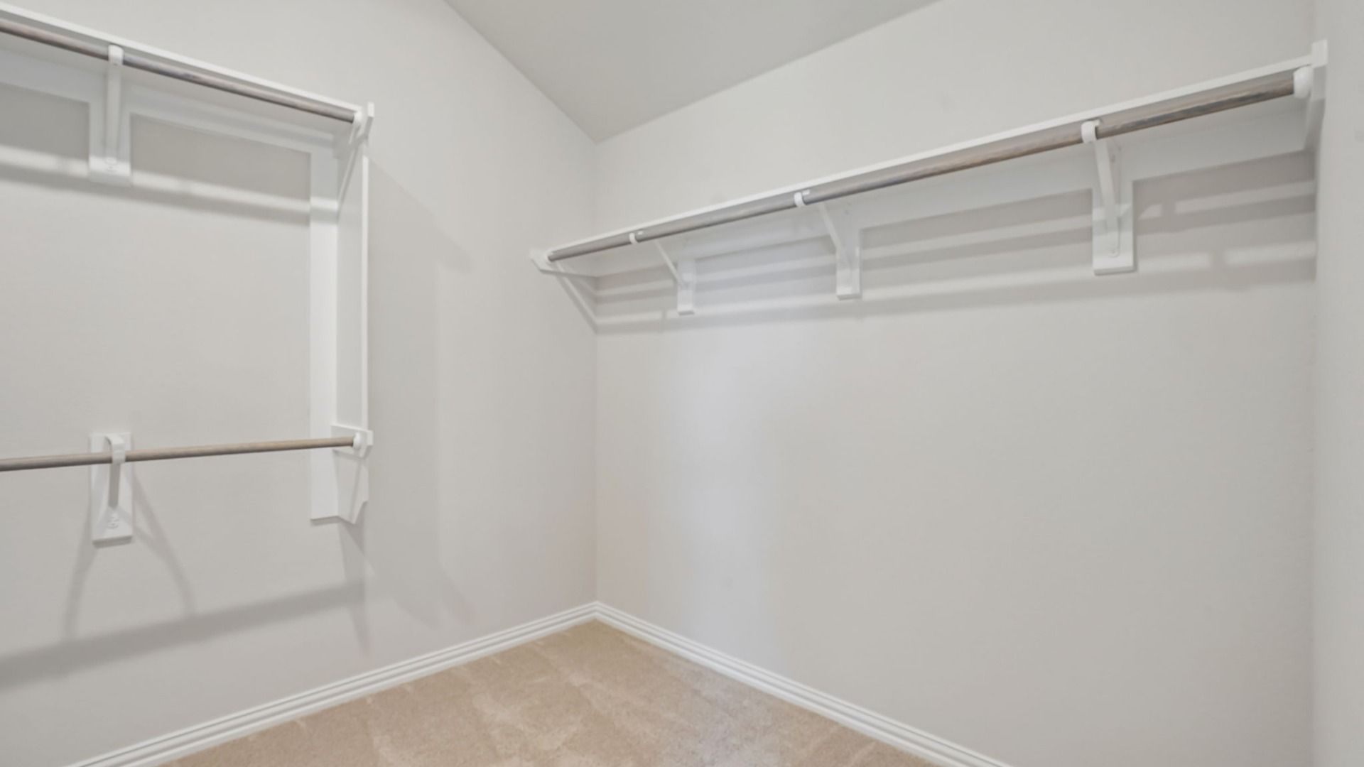 Generous owner's suite closet with plenty of room for storage and organization.