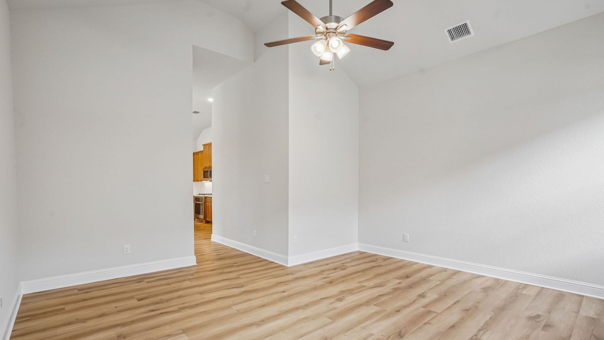 Versatile flex room with high ceilings and abundant natural light.