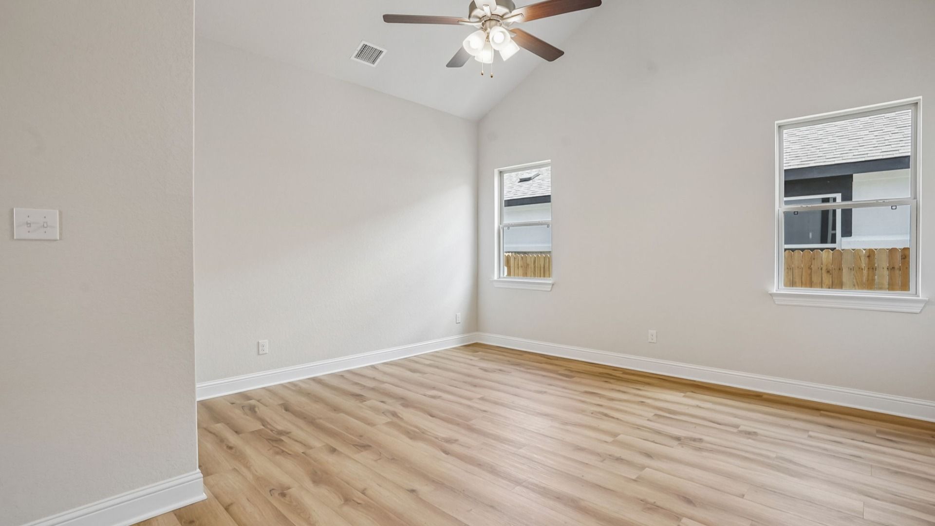 Versatile flex room with high ceilings and abundant natural light.