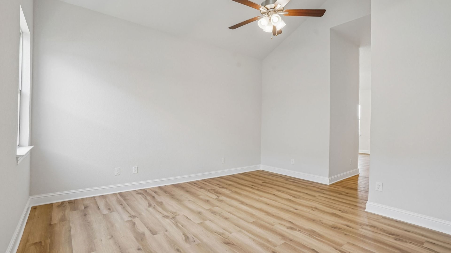 Versatile flex room with high ceilings and abundant natural light.