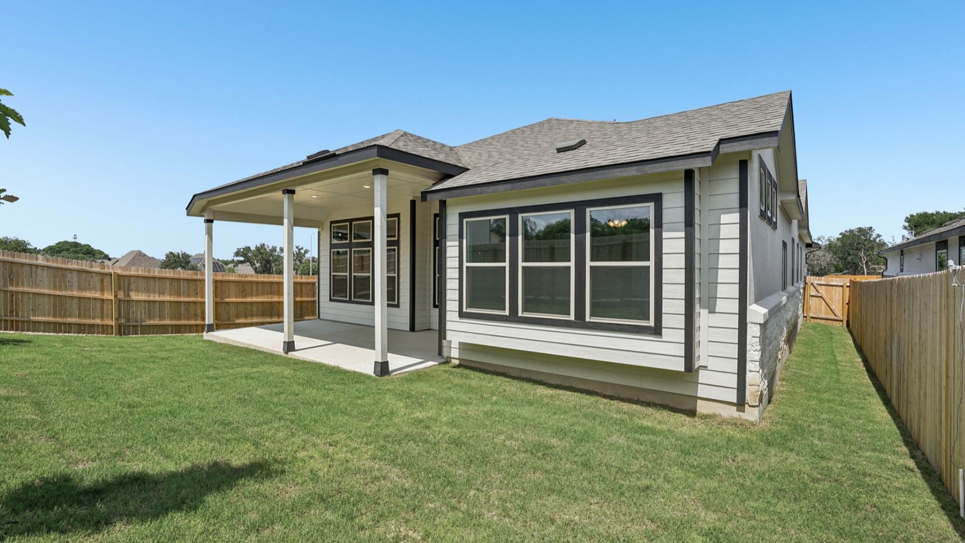 Inviting covered patio with peaceful backyard views.