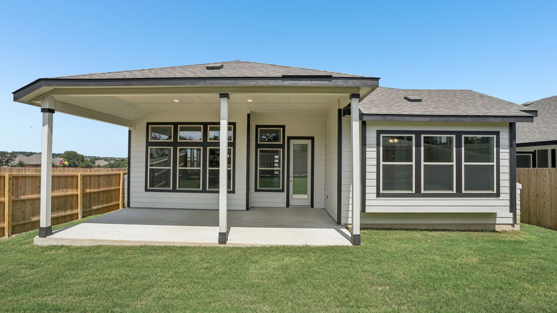 Inviting covered patio with peaceful backyard views.