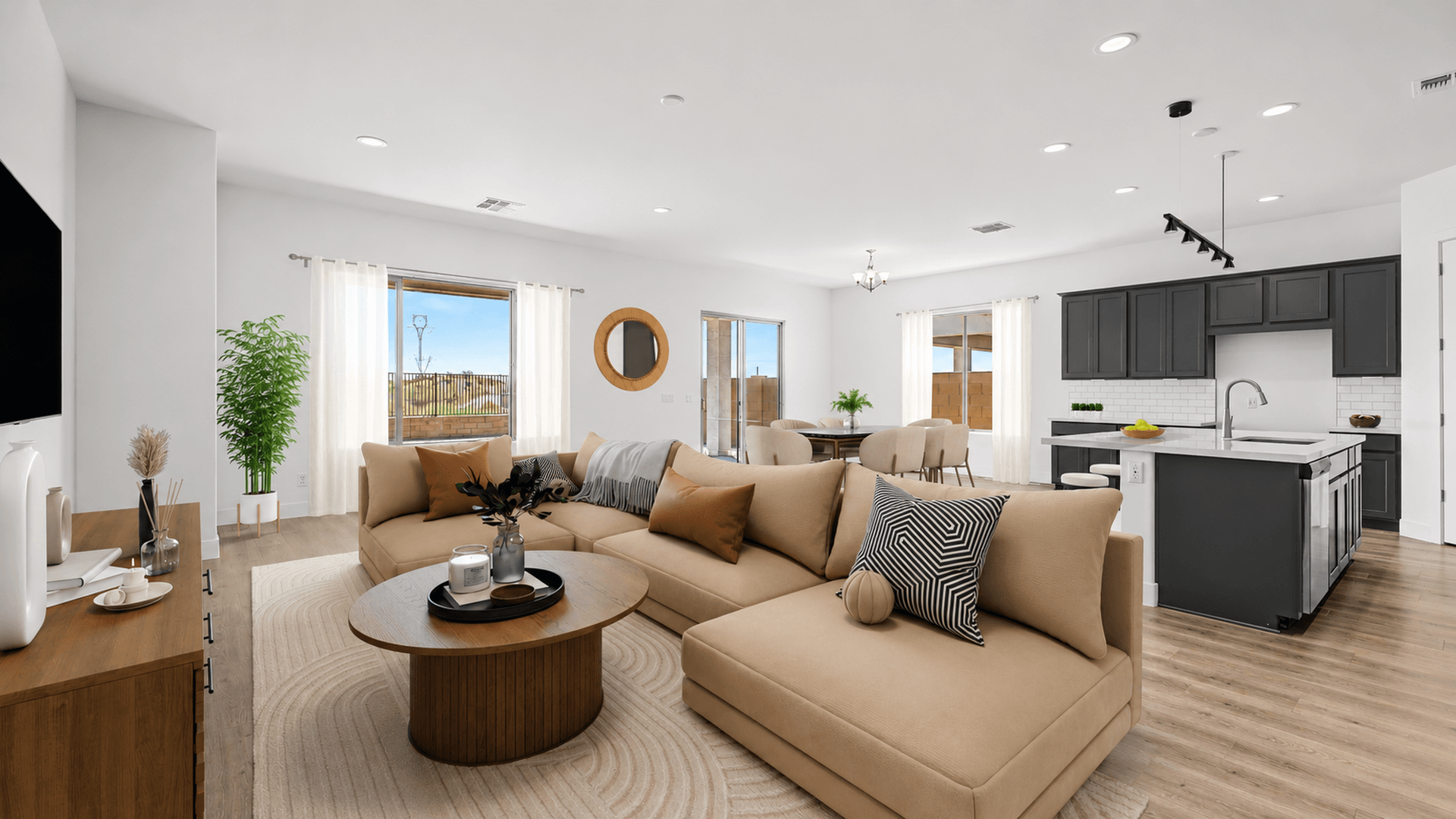 Staged great room view in move-in ready home by DRB Homes at Hacienda at Estrella, 16825 W. Ardmore Road, Goodyear, AZ 85338