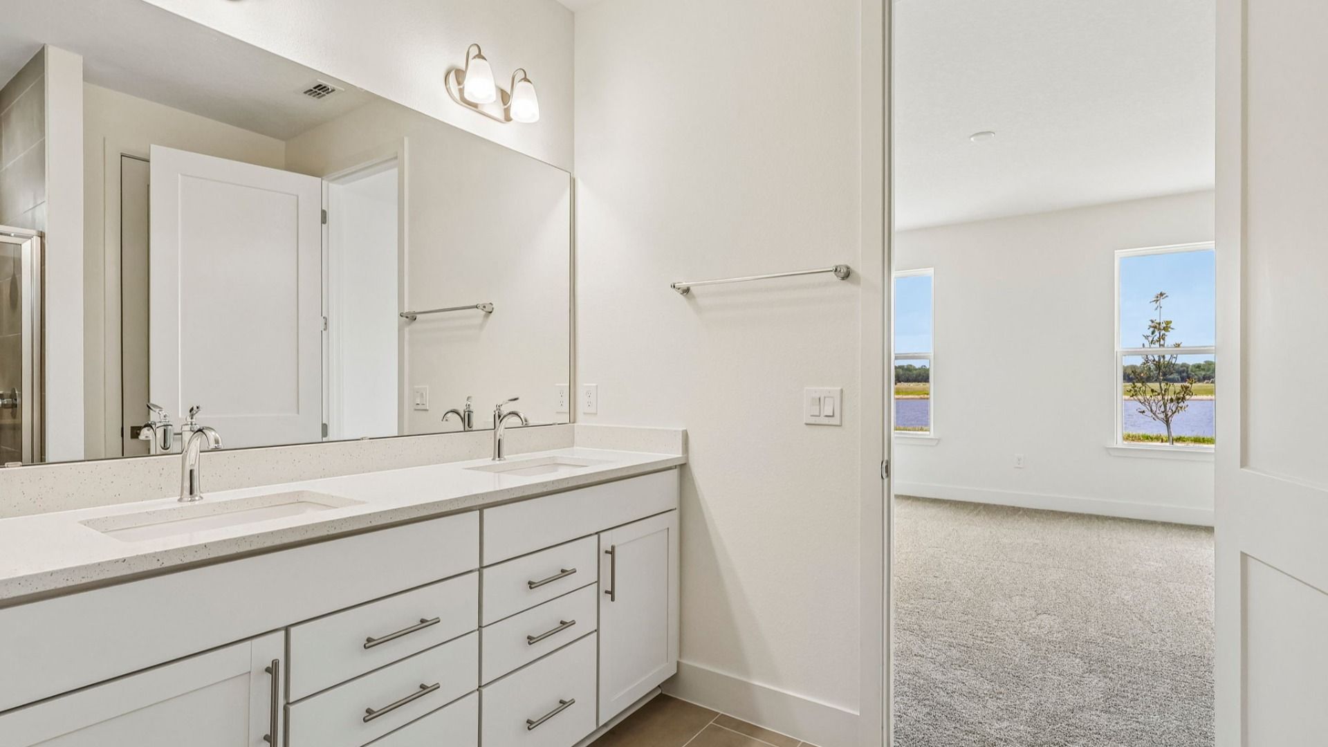 Longleaf Primary Suite Bath with Dual Vanity Sinks by DRB Homes in Trailside New Homes in Mount Dora FL