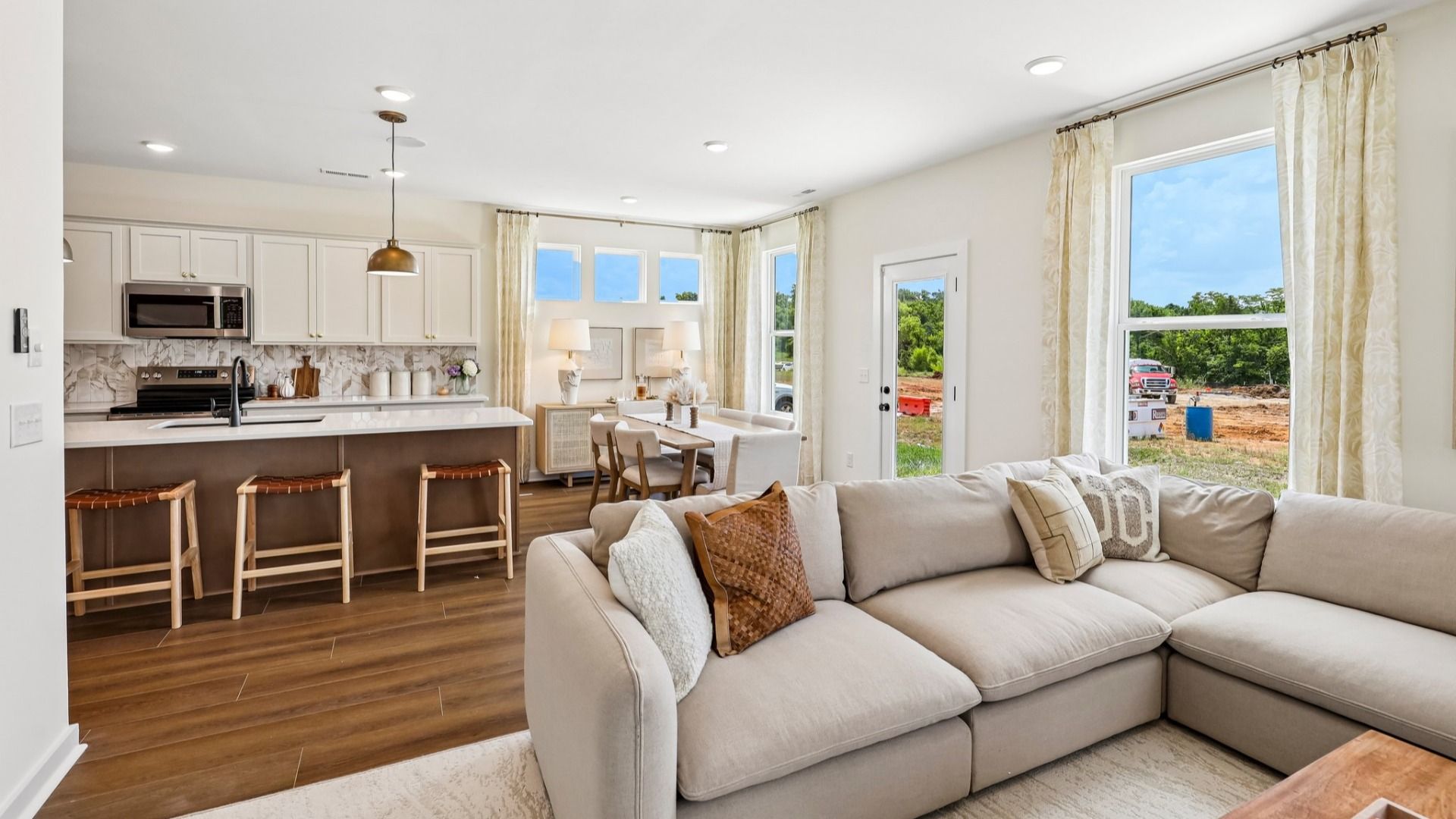 Gathering room with view of dining and kitchen areas