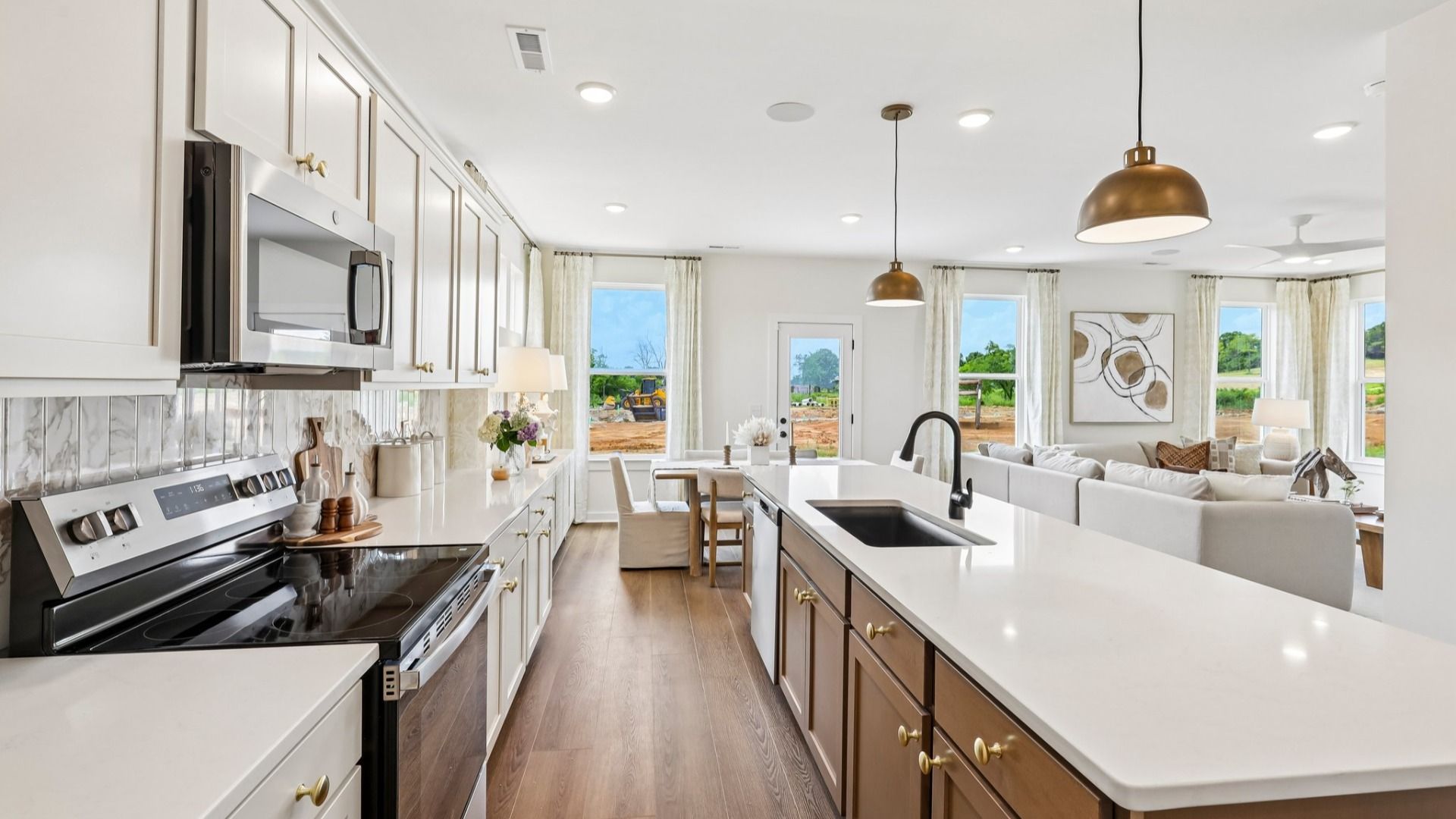 Kitchen with tile backsplash, pendant lighting, and quartz countertops