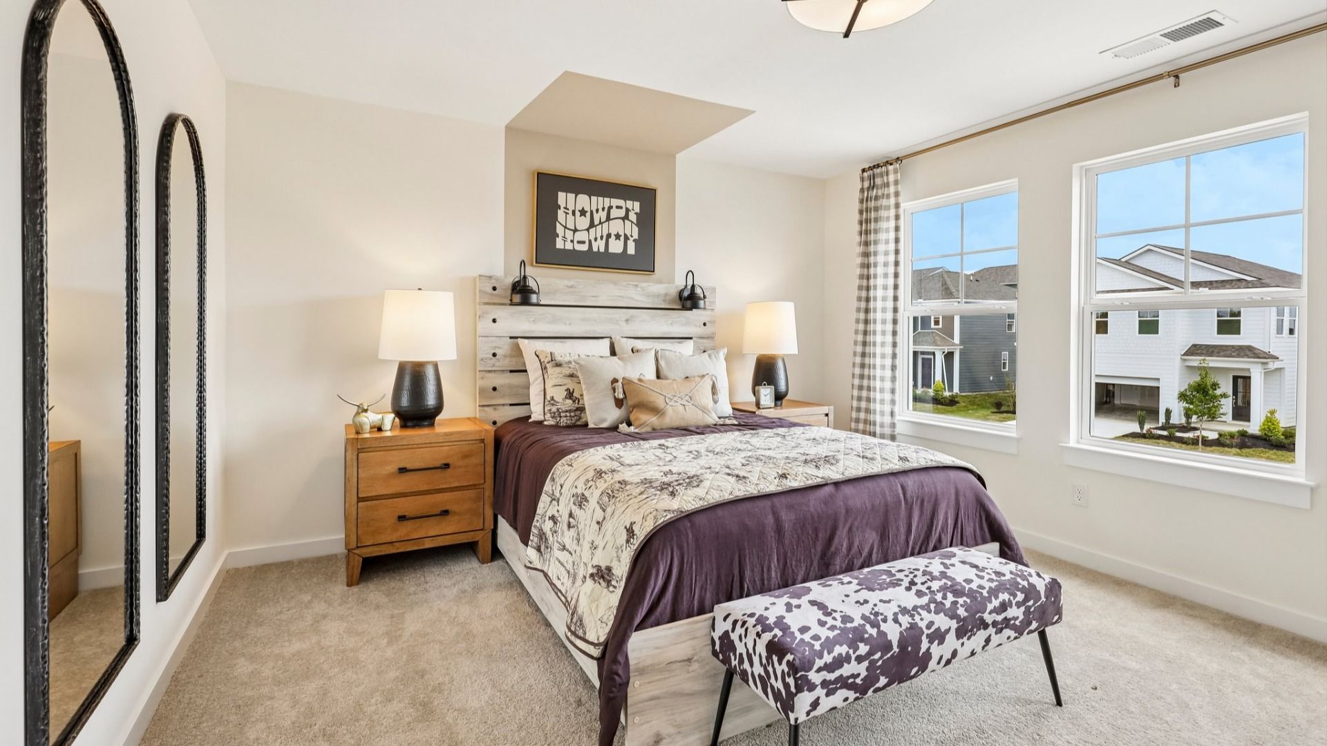 Secondary bedroom with carpet, closet, and window