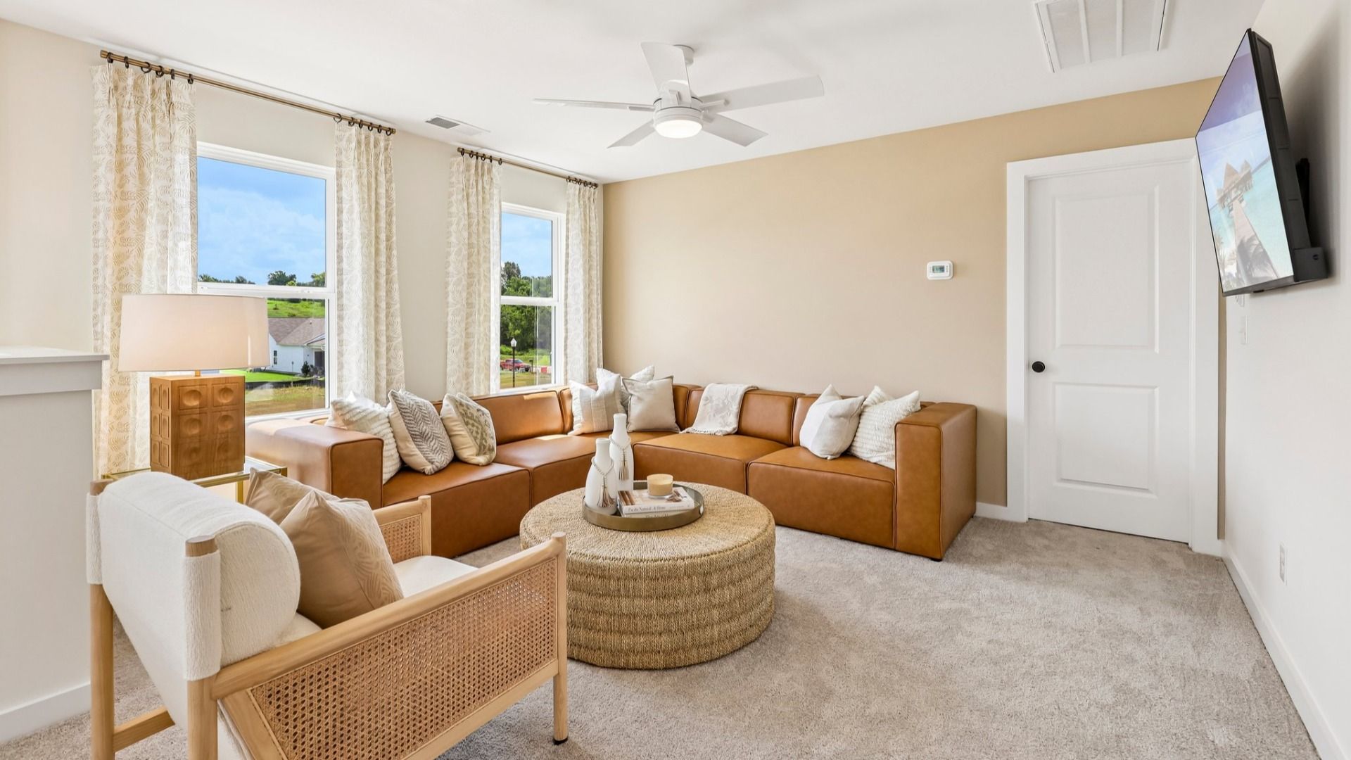 Loft area with carpet and natural lighting from windows