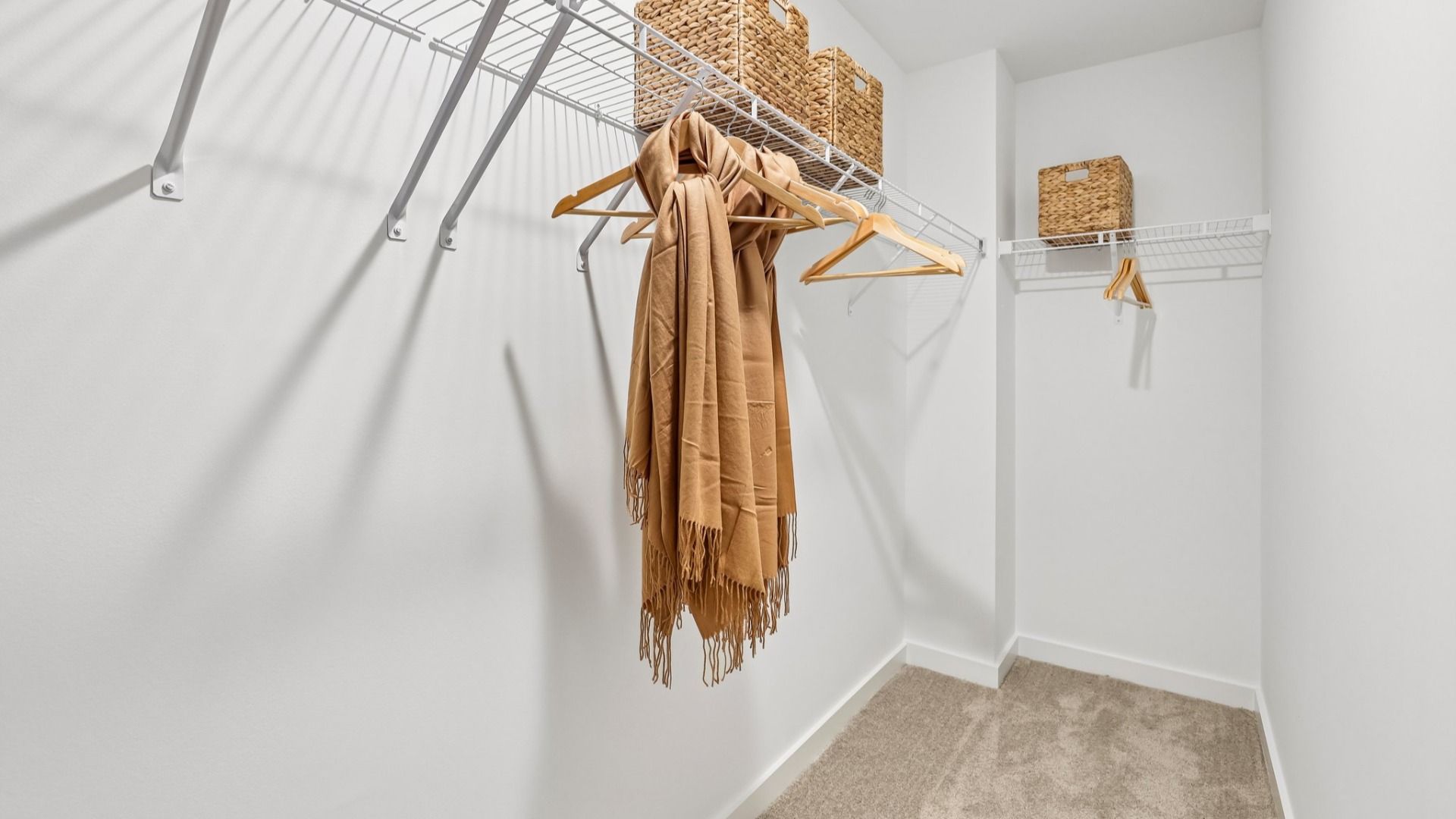 Spacious primary closet with ventilated shelf