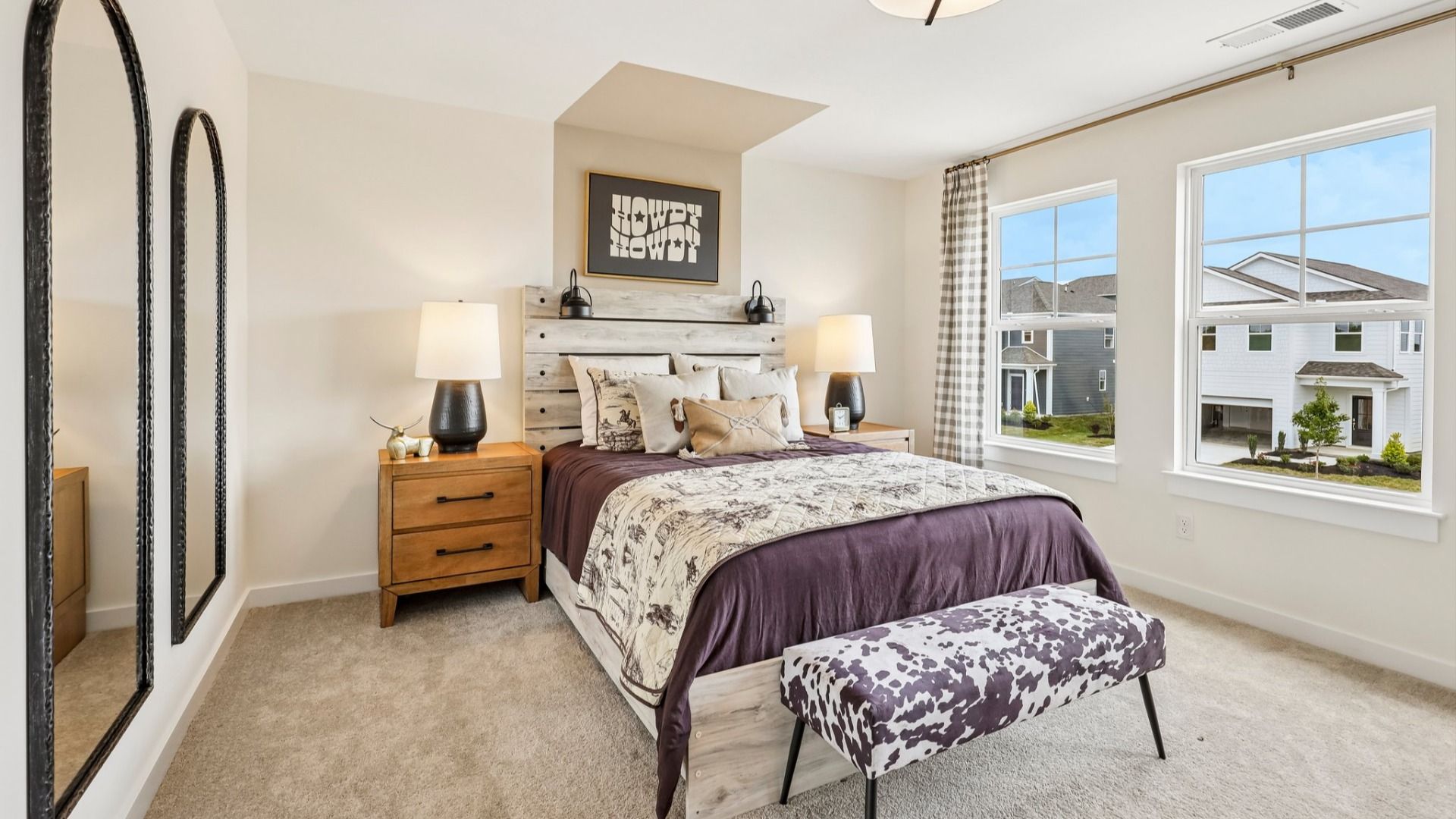 Secondary bedroom with carpet, closet, and window