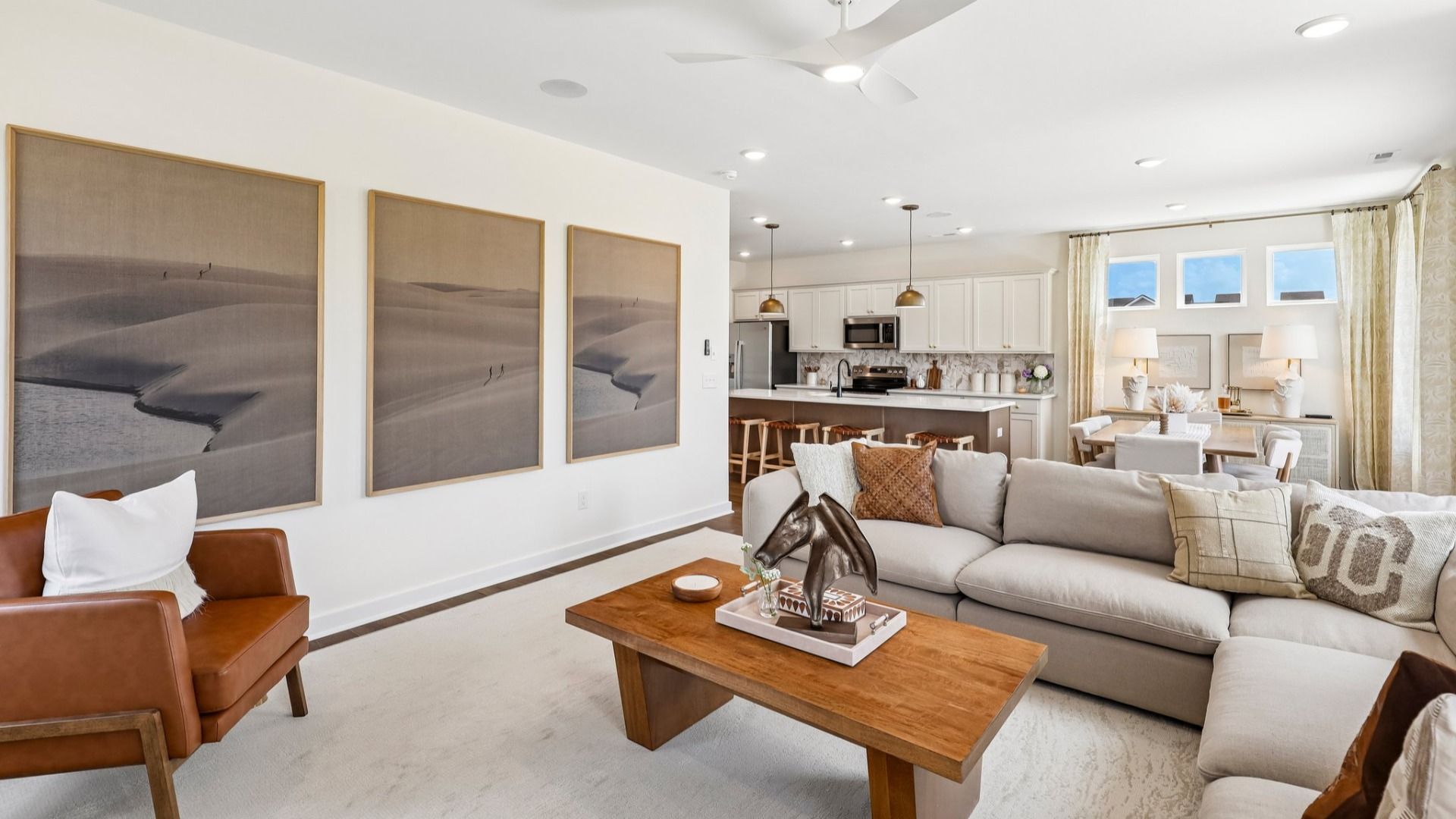Gathering room with ceiling fan, windows, and fireplace