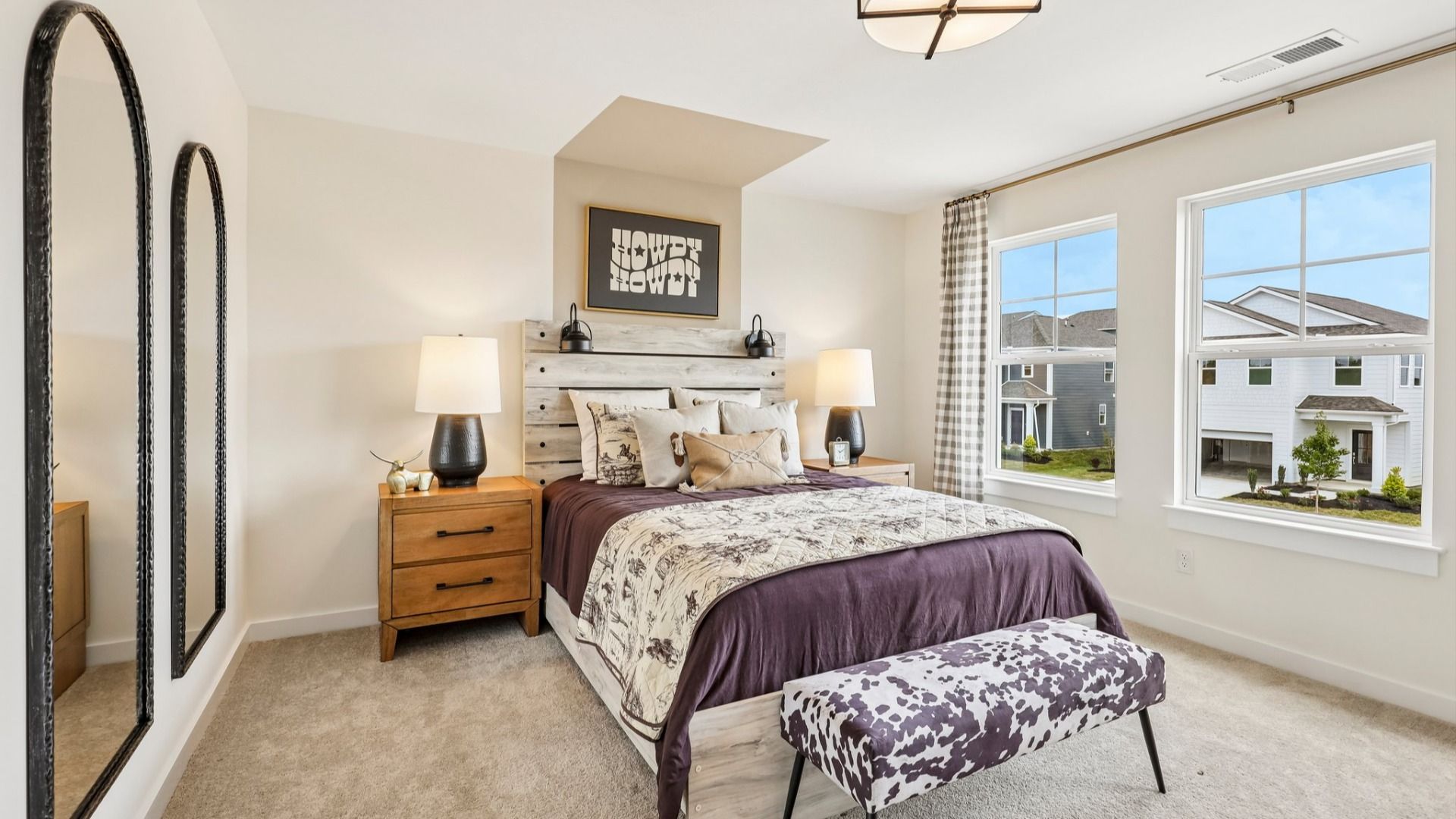Secondary bedroom with carpet, closet, and window