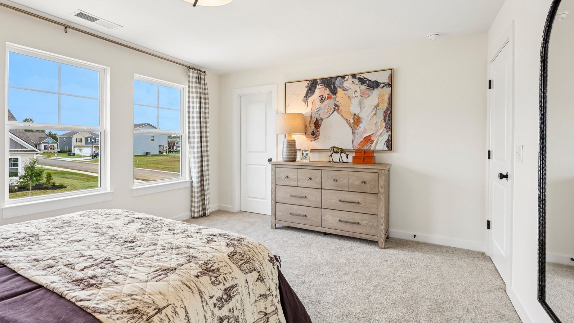 Secondary bedroom with carpet, closet, and window