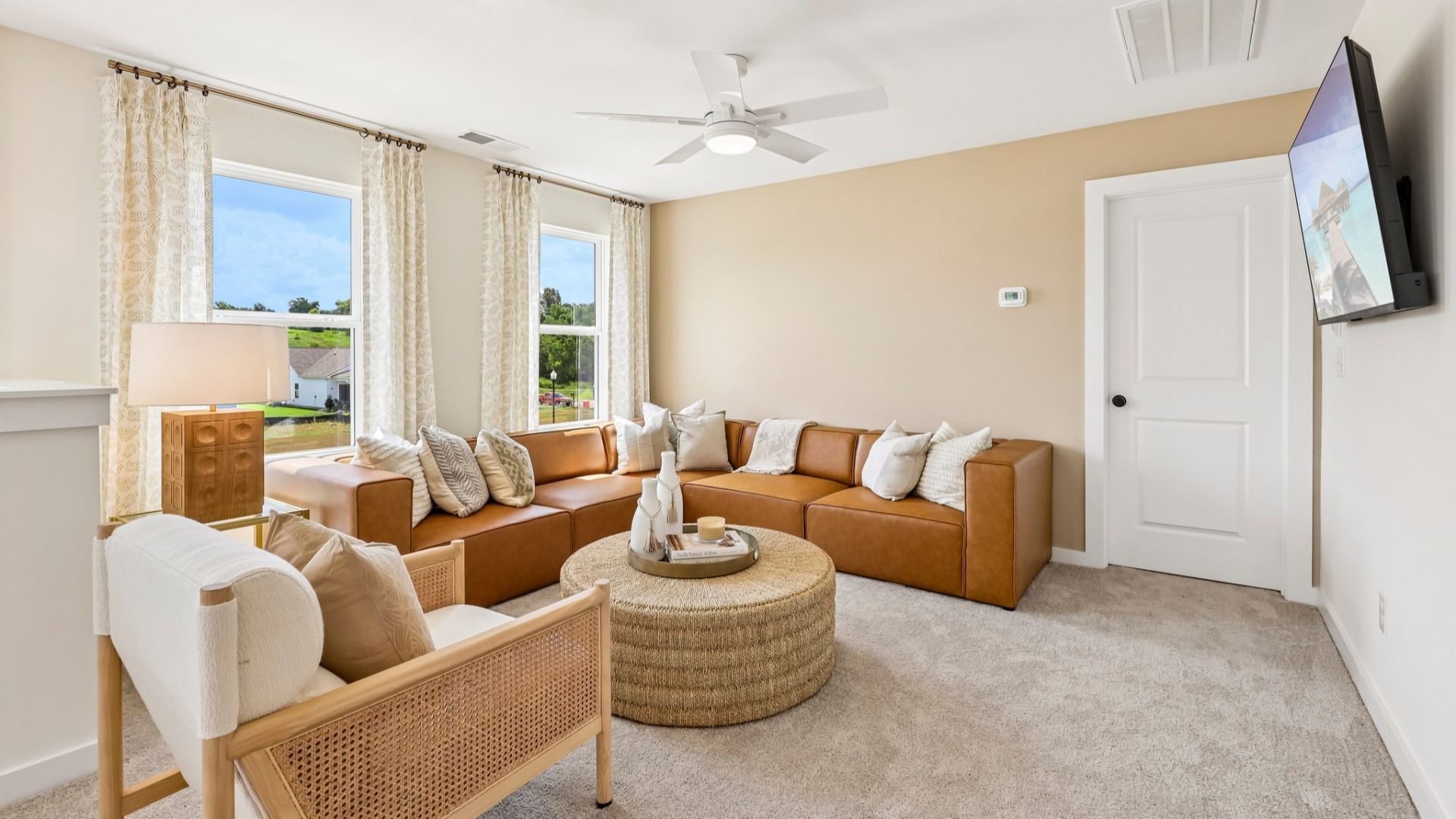 Loft area with carpet and natural lighting from windows