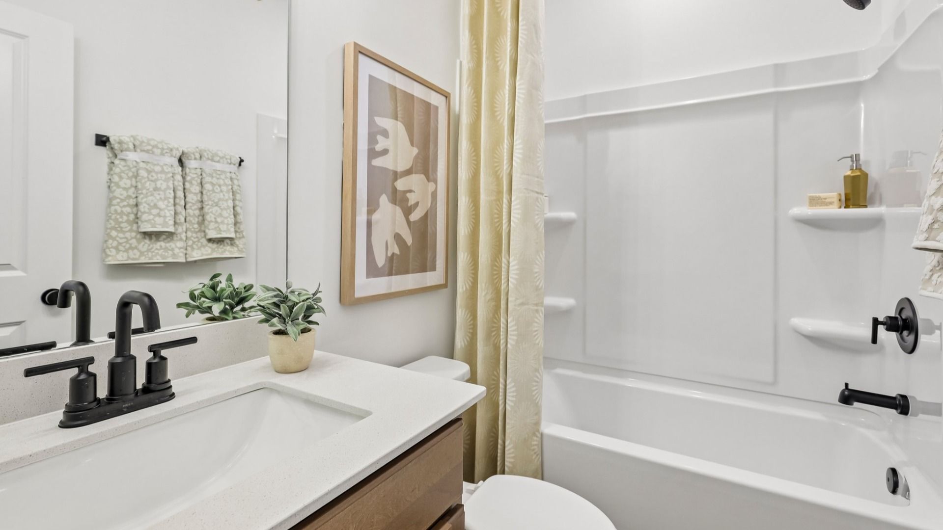 Bathroom with vanity, toilet, and shower