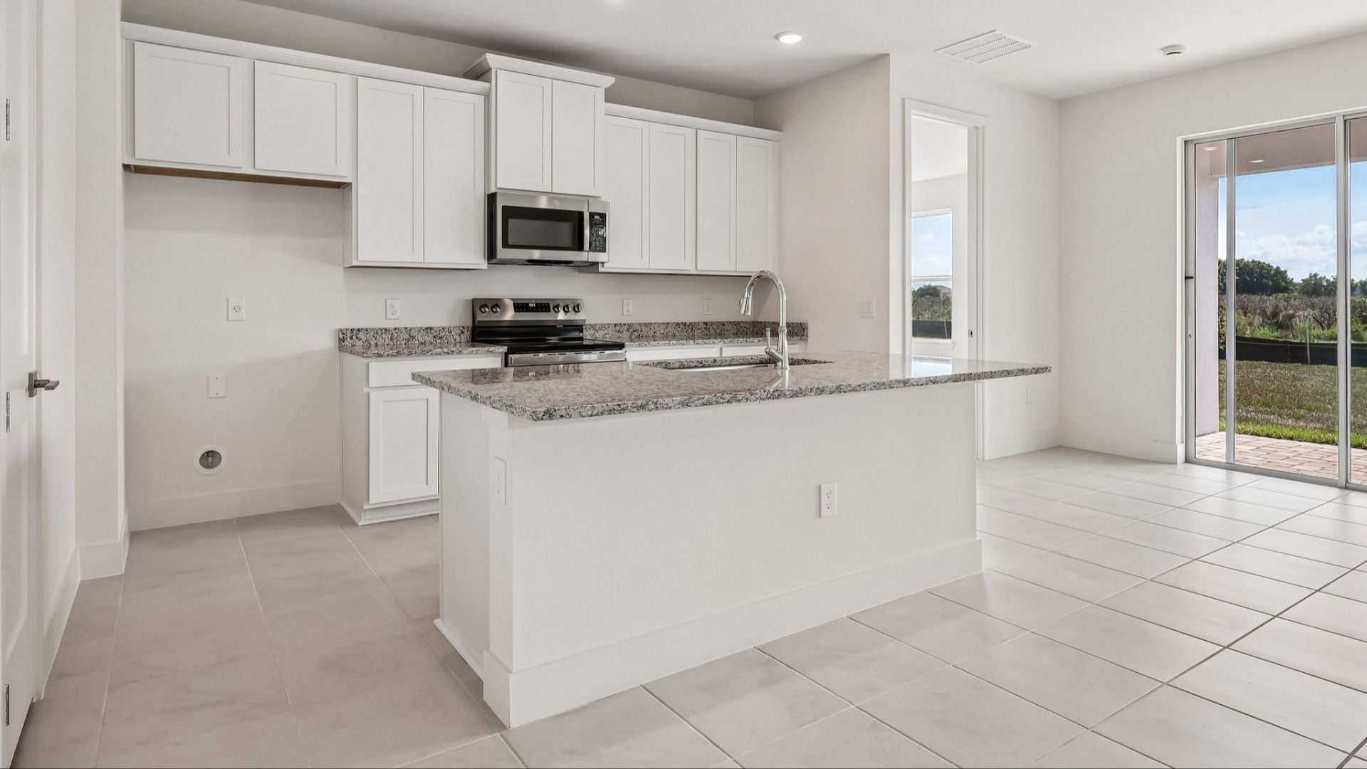 Acacia Floor Plan Kitchen in New Home Community Lakeside at Satilla in St. Cloud, FL