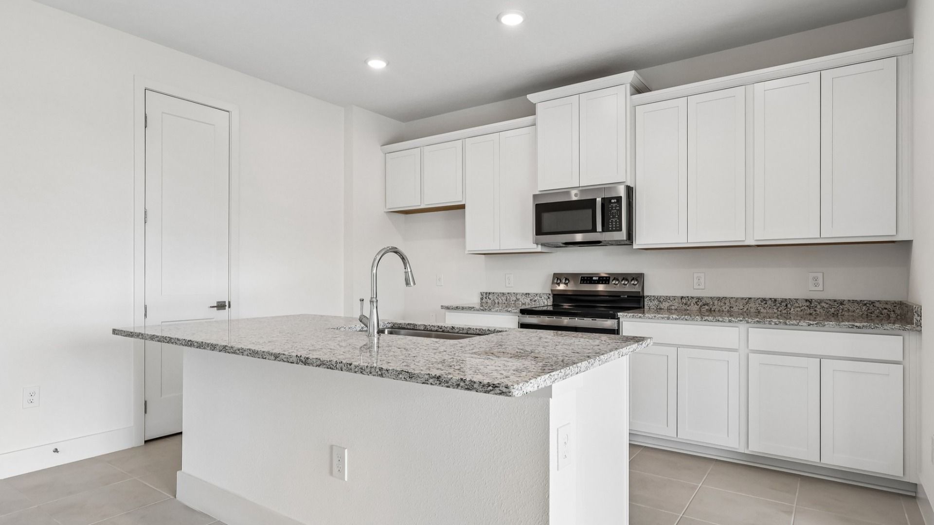 Acacia Floor Plan Kitchen in New Home Community Lakeside at Satilla in St. Cloud, FL