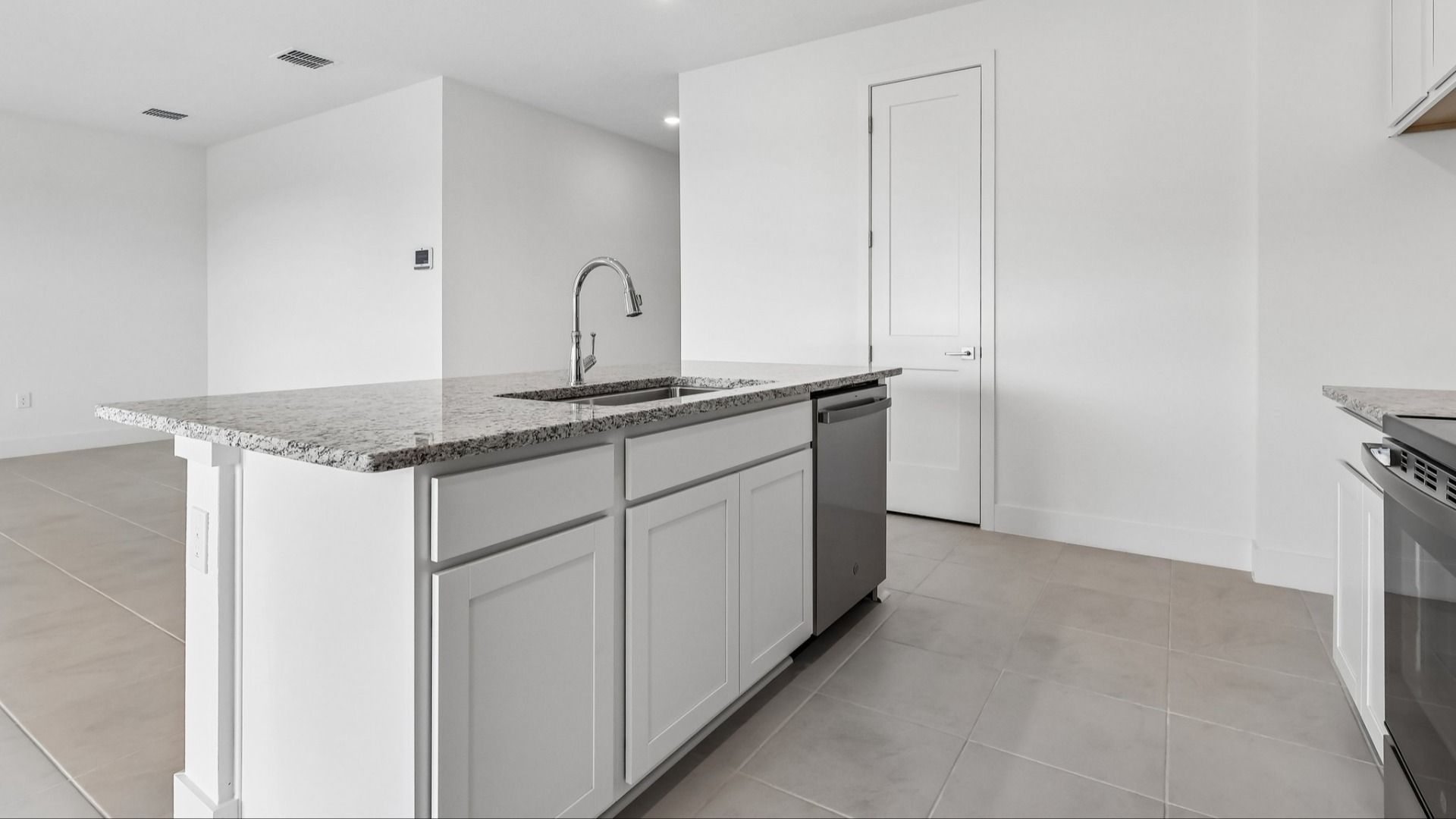 Acacia Floor Plan Kitchen in New Home Community Lakeside at Satilla in St. Cloud, FL