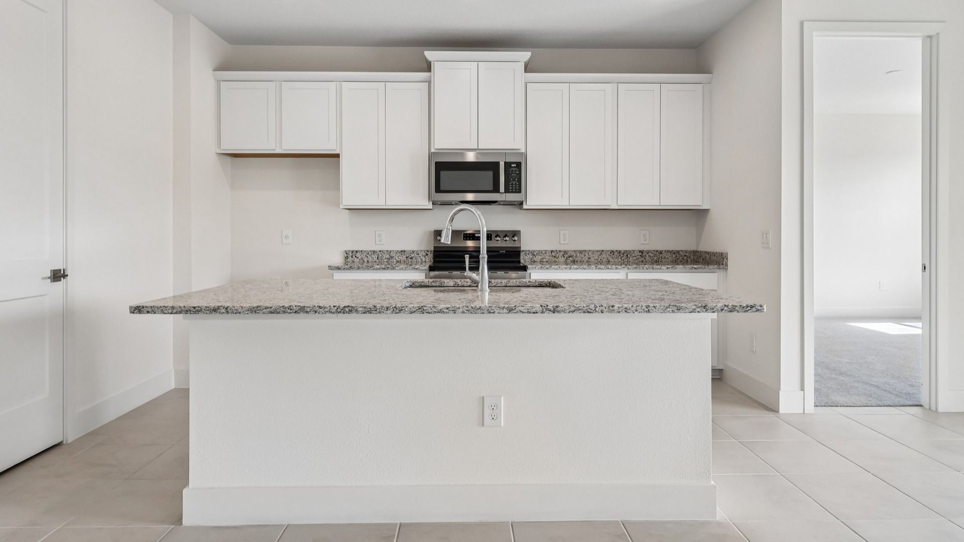 Acacia Floor Plan Kitchen in New Home Community Lakeside at Satilla in St. Cloud, FL