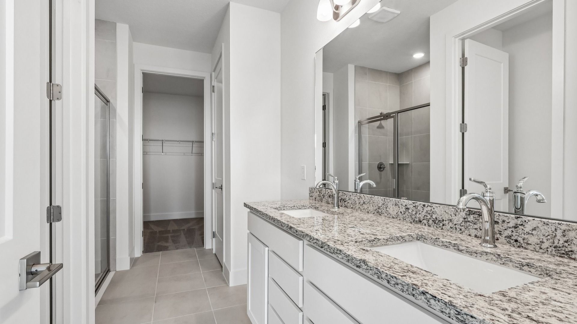 Acacia Floor Plan Primary En Suite Bathroom showcasing Dual Vanity in New Home Community Lakeside at Satilla in St. Cloud, FL
