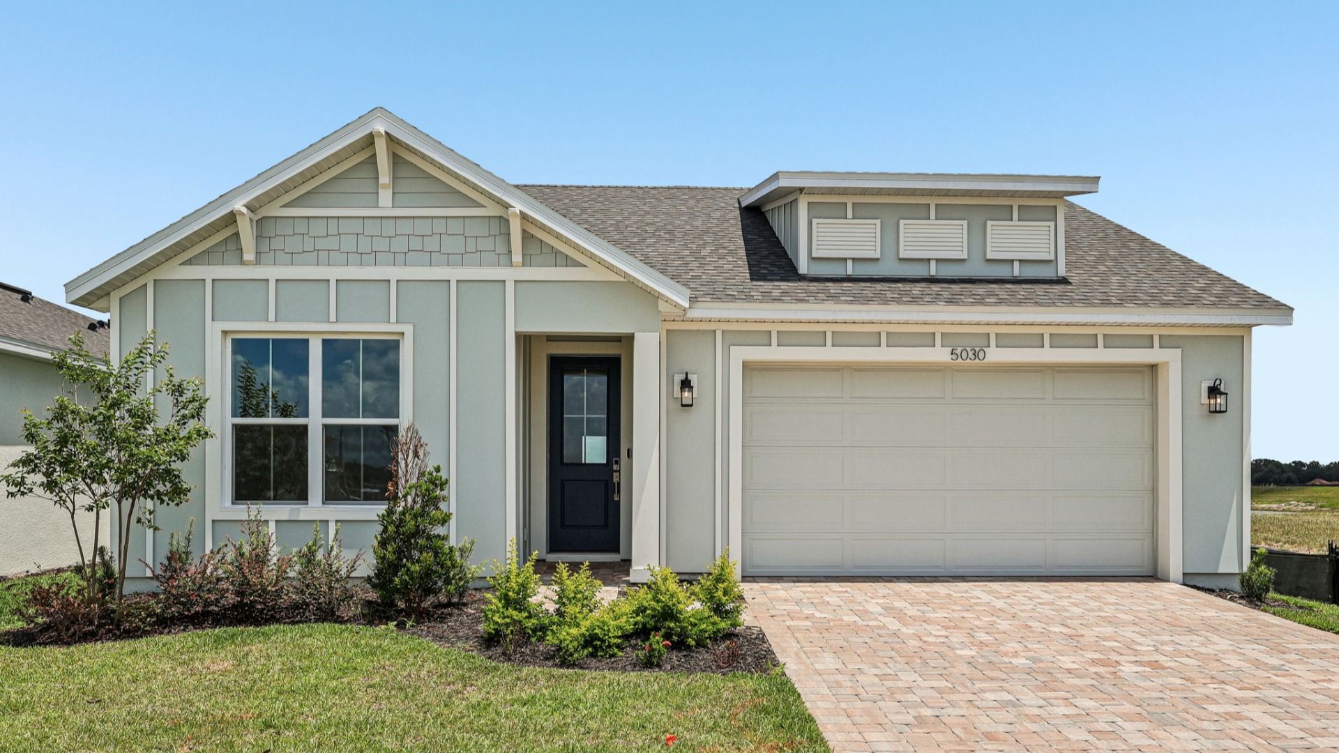 Longleaf Floor Plan Front Exterior by DRB Homes in Lakeside at Satilla in New Homes St. Cloud