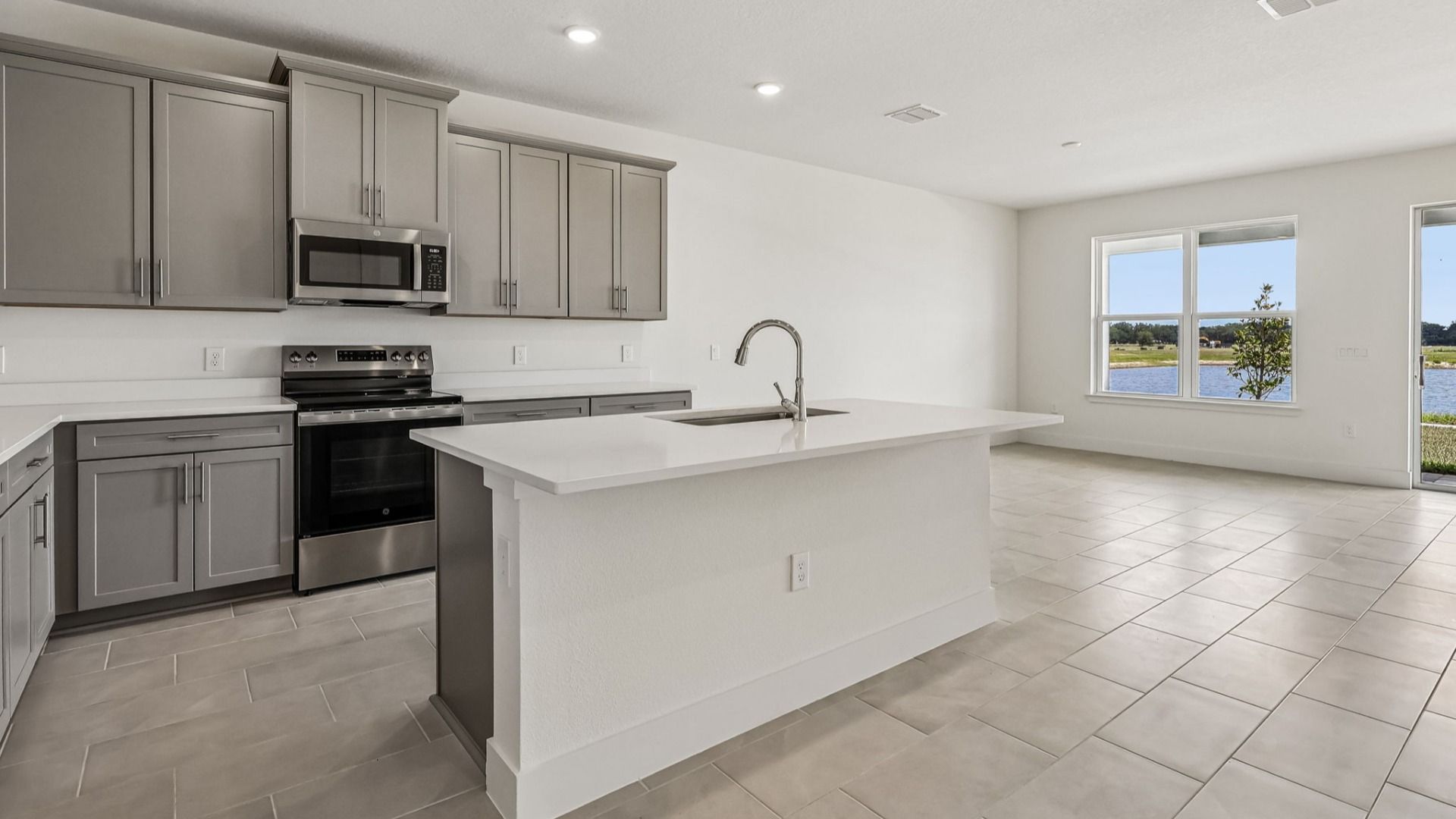 Longleaf Floor Plan Kitchen and Lake Views DRB Homes Lakeside at Satilla in New Homes St. Cloud