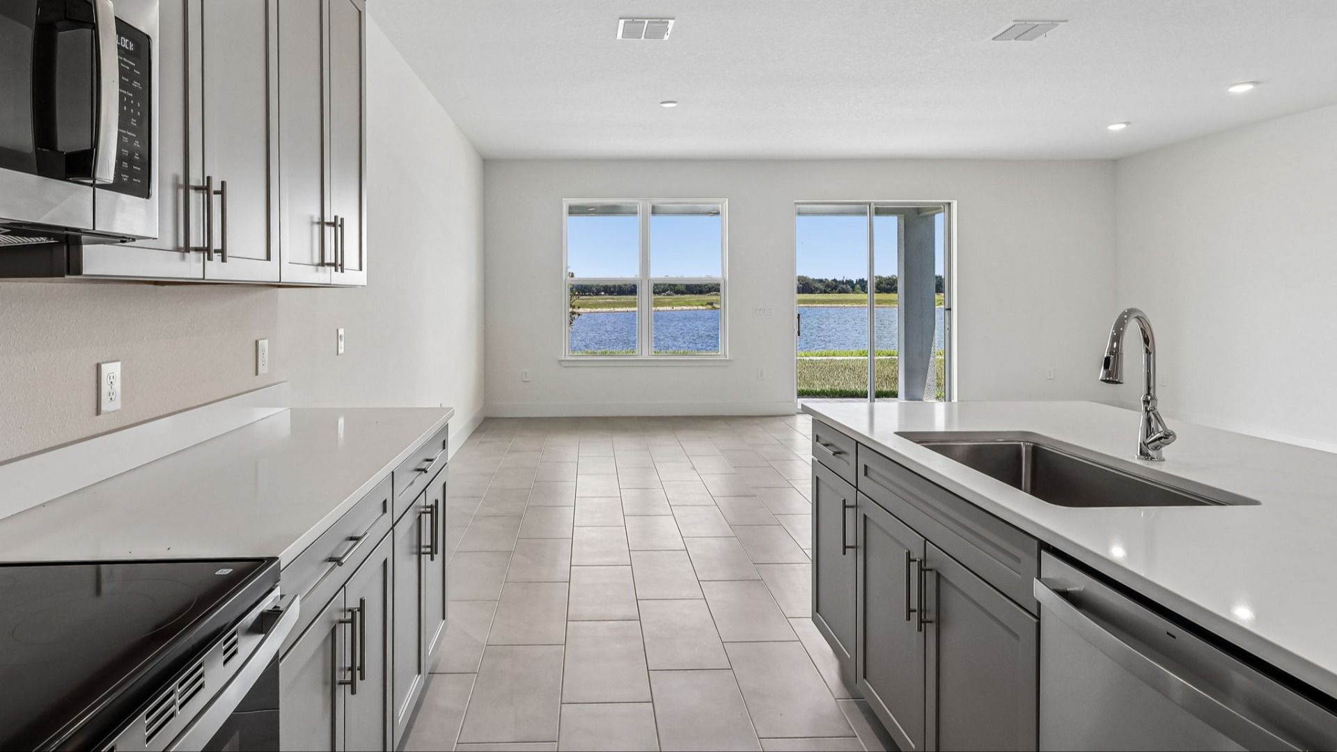 Longleaf Floor Plan Kitchen and Lake Views by DRB Homes Lakeside at Satilla in New Homes St. Cloud
