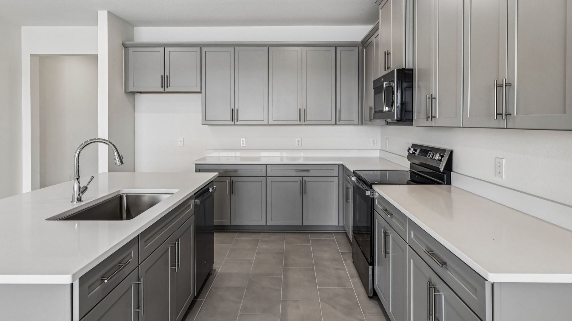 Longleaf Floor Plan Kitchen and Stunning Island by DRB Homes Lakeside at Satilla in New Homes St. Cloud