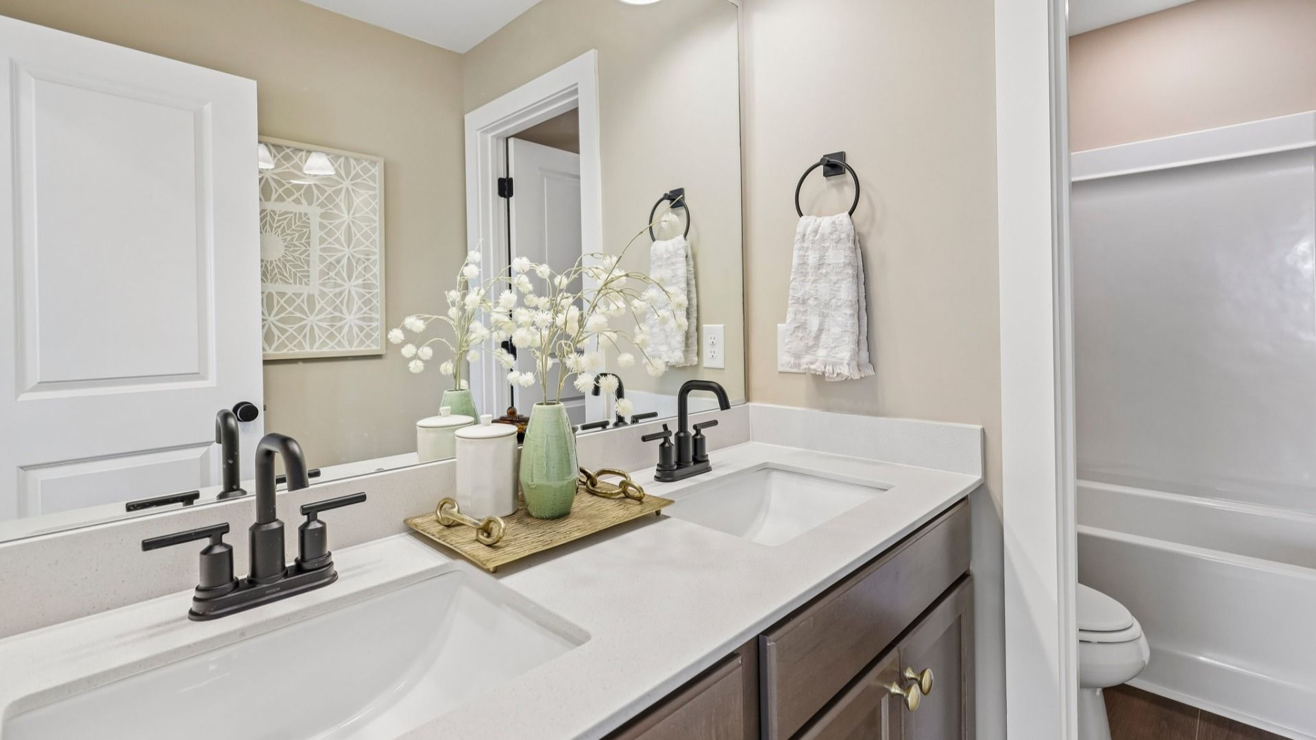 Secondary spacious bathroom with dual vanity