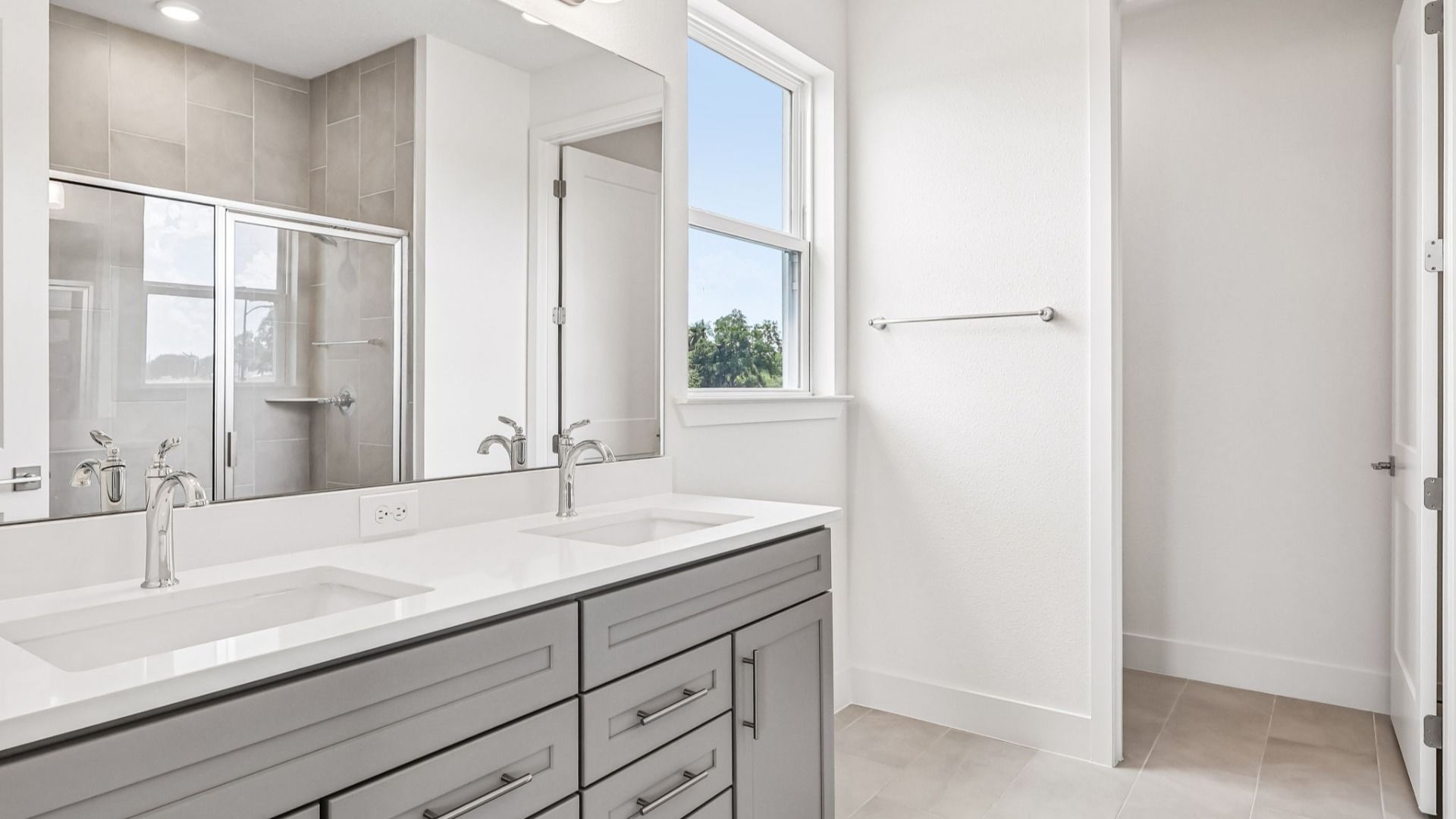 Longleaf Floor Plan Primary Suite Bath with Dual Sink Vanity by DRB Homes Lakeside at Satilla in New Homes St. Cloud