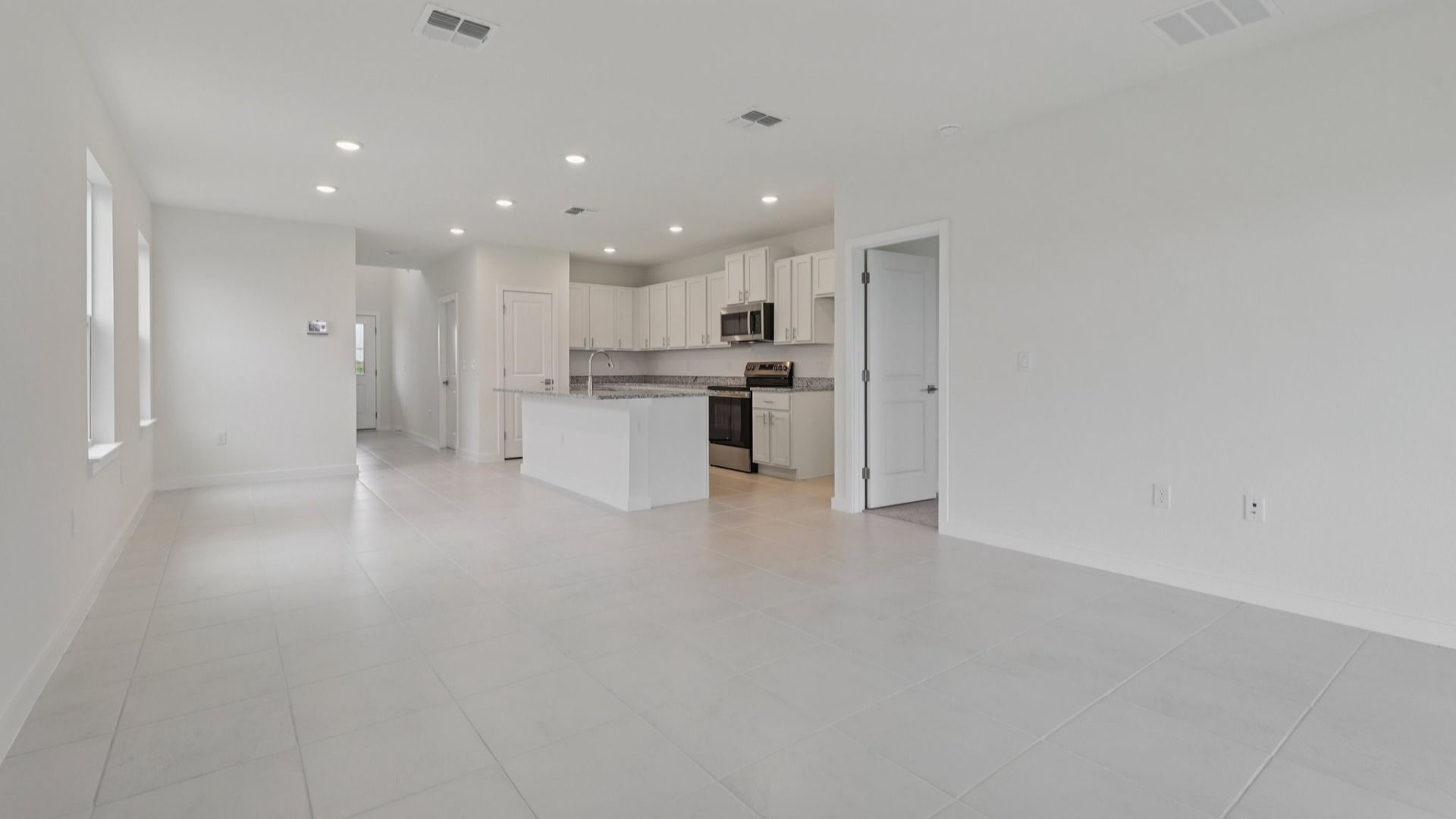 Living Area and Kitchen in the Naples Floor Plan by DRB Homes