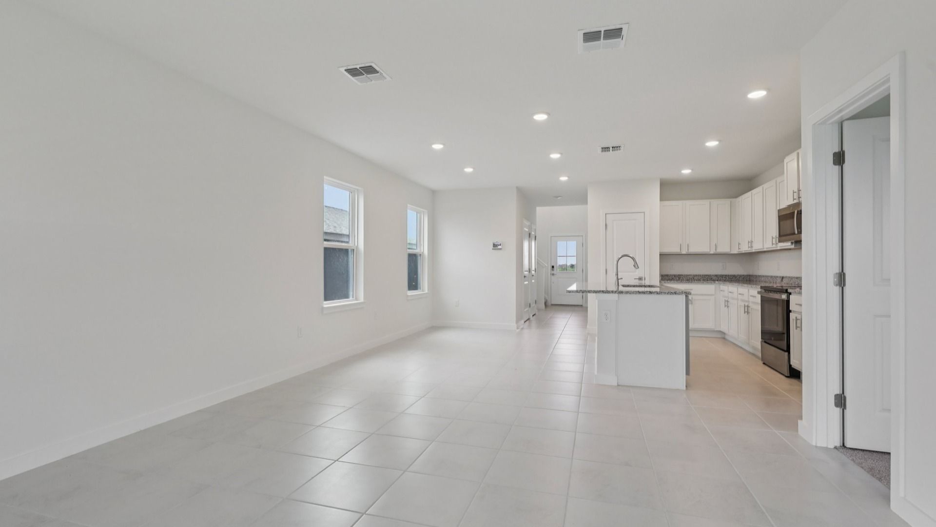 Living Area and Kitchen in the Naples Floor Plan by DRB Homes