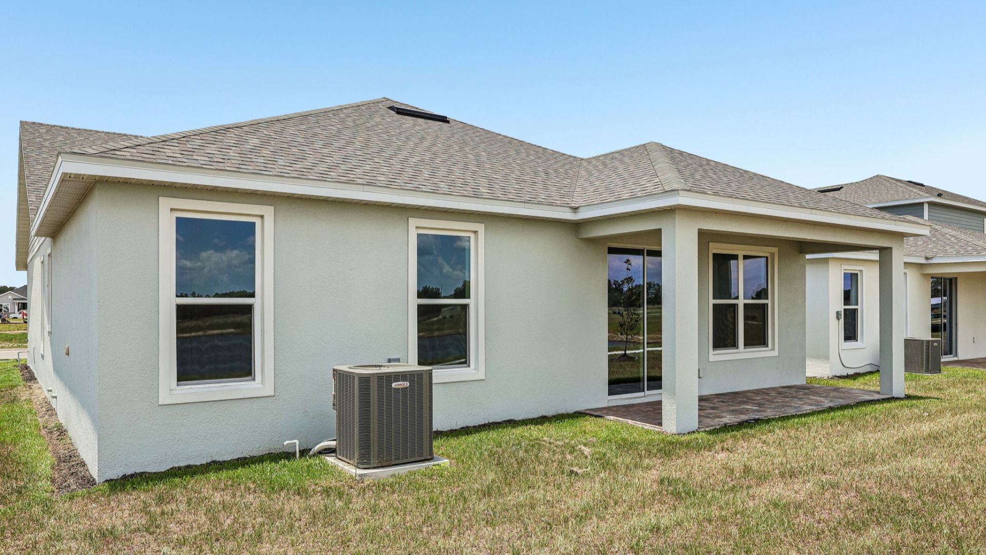 Longleaf Floor Plan Exterior with Back Porch New Homes in St. Cloud at Lakeside at Satilla