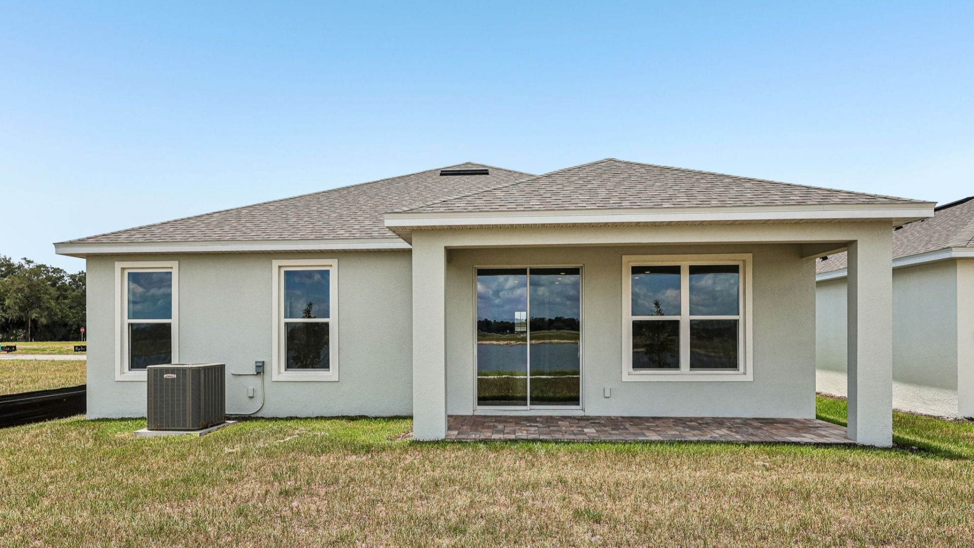 Longleaf Floor Plan Exterior with Back Porch New Homes in St. Cloud at Lakeside at Satilla