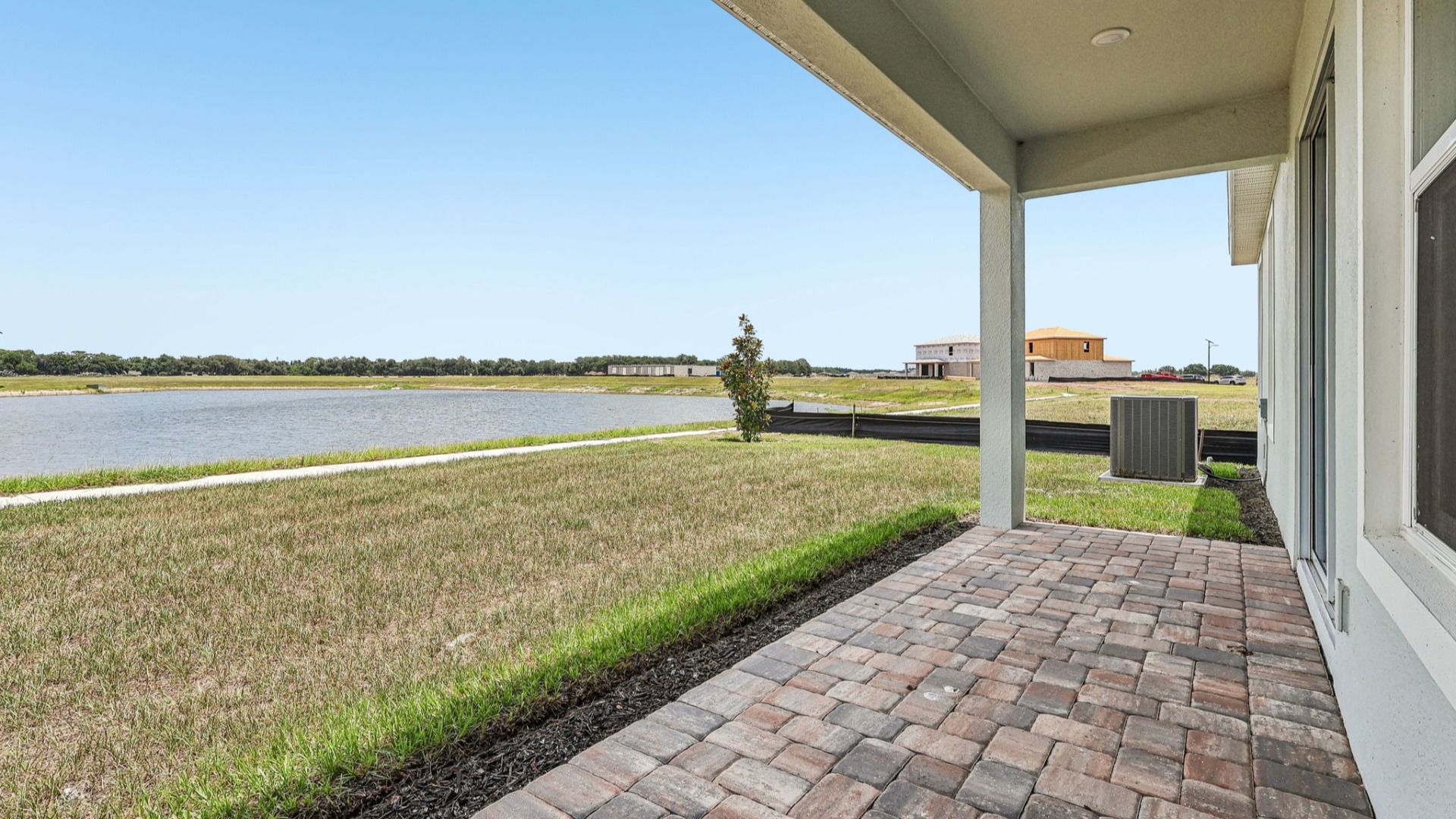 Longleaf Floor Plan Exterior with Back Porch New Homes in St. Cloud at Lakeside at Satilla