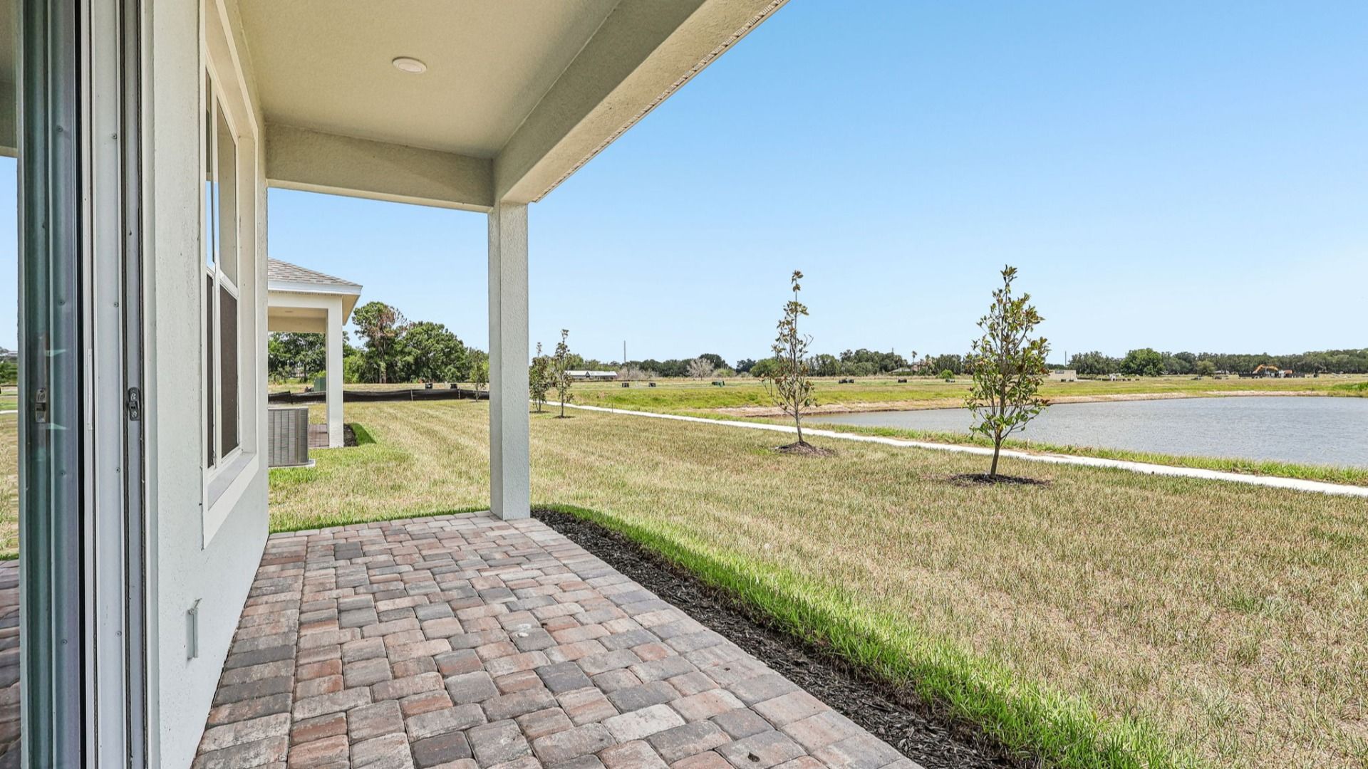 Longleaf Floor Plan Exterior with Back Porch New Homes in St. Cloud at Lakeside at Satilla