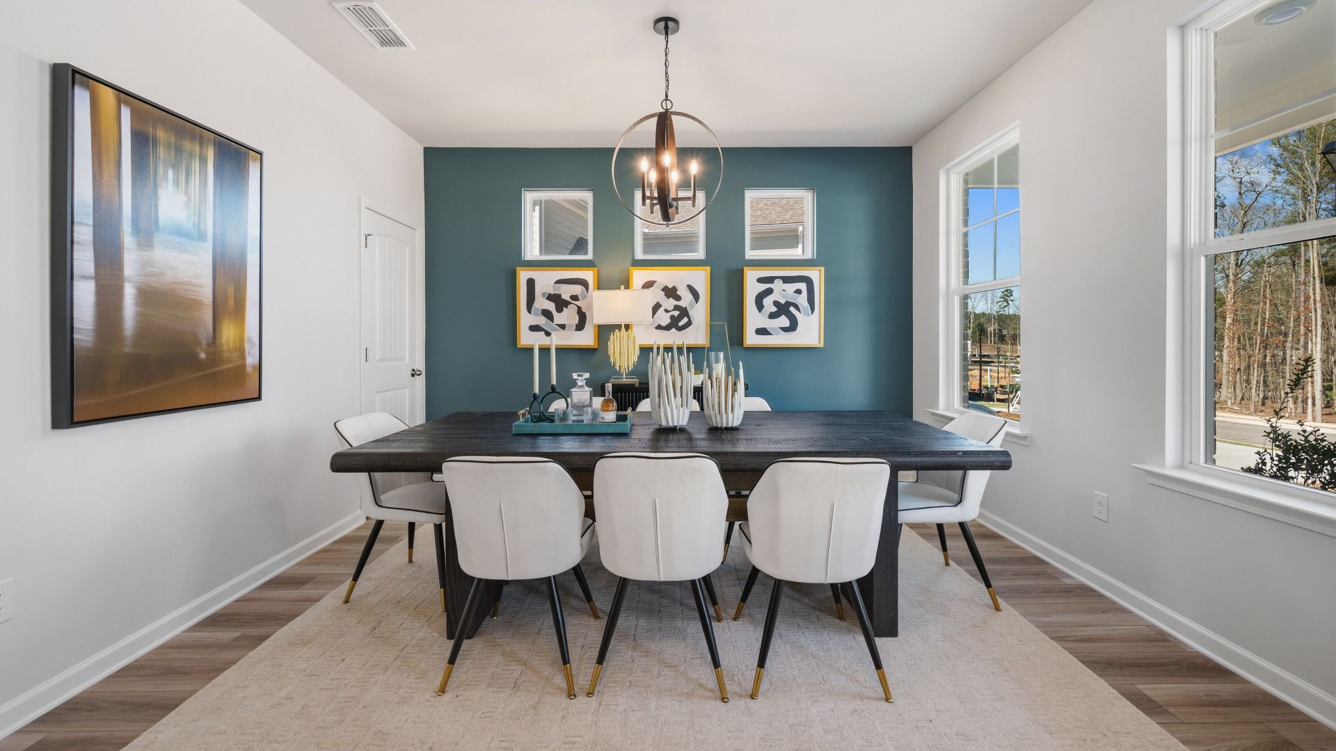 Dining area with accent wall and natural lighting from windows