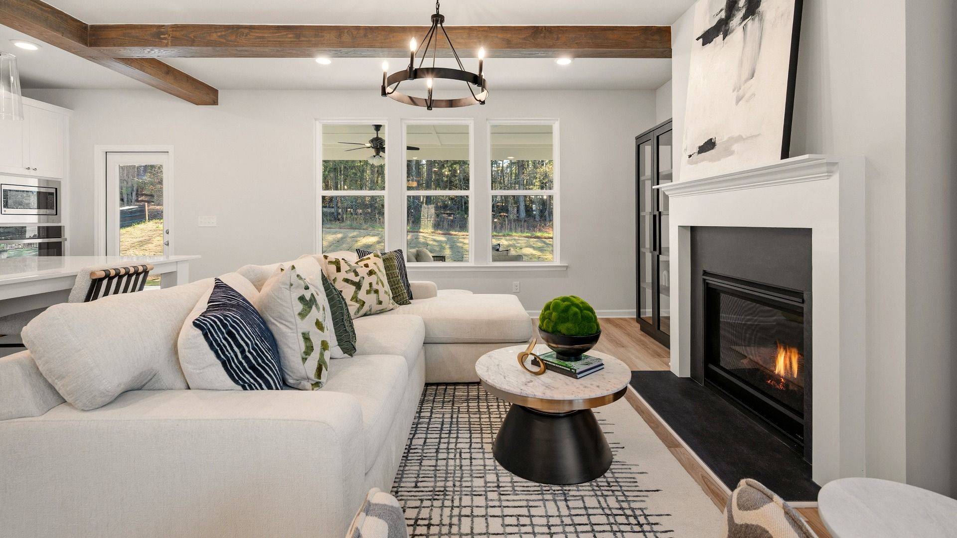 Gathering room with accent ceiling, fireplace, and windows
