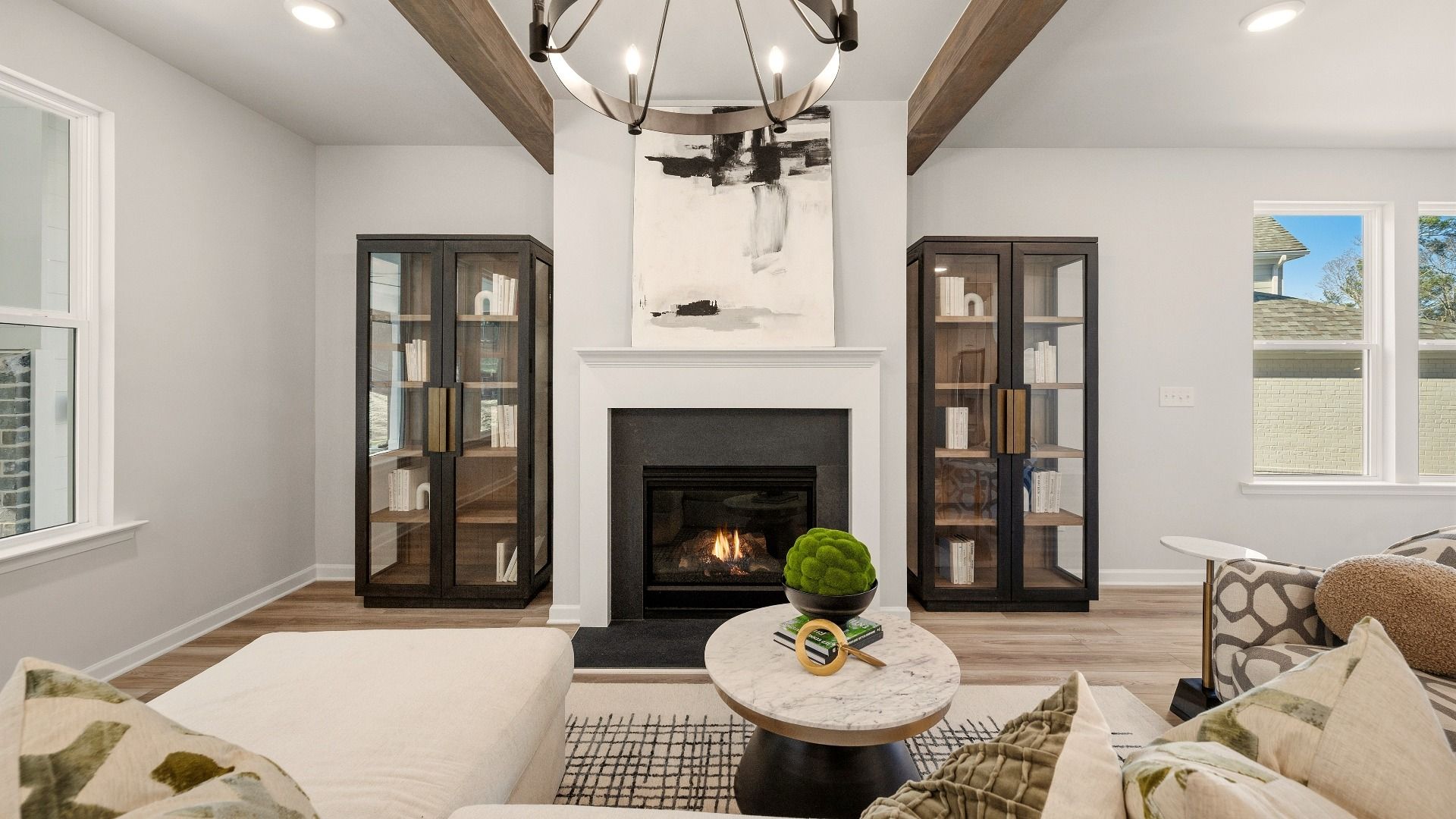 Gathering room with accent ceiling, fireplace, and windows