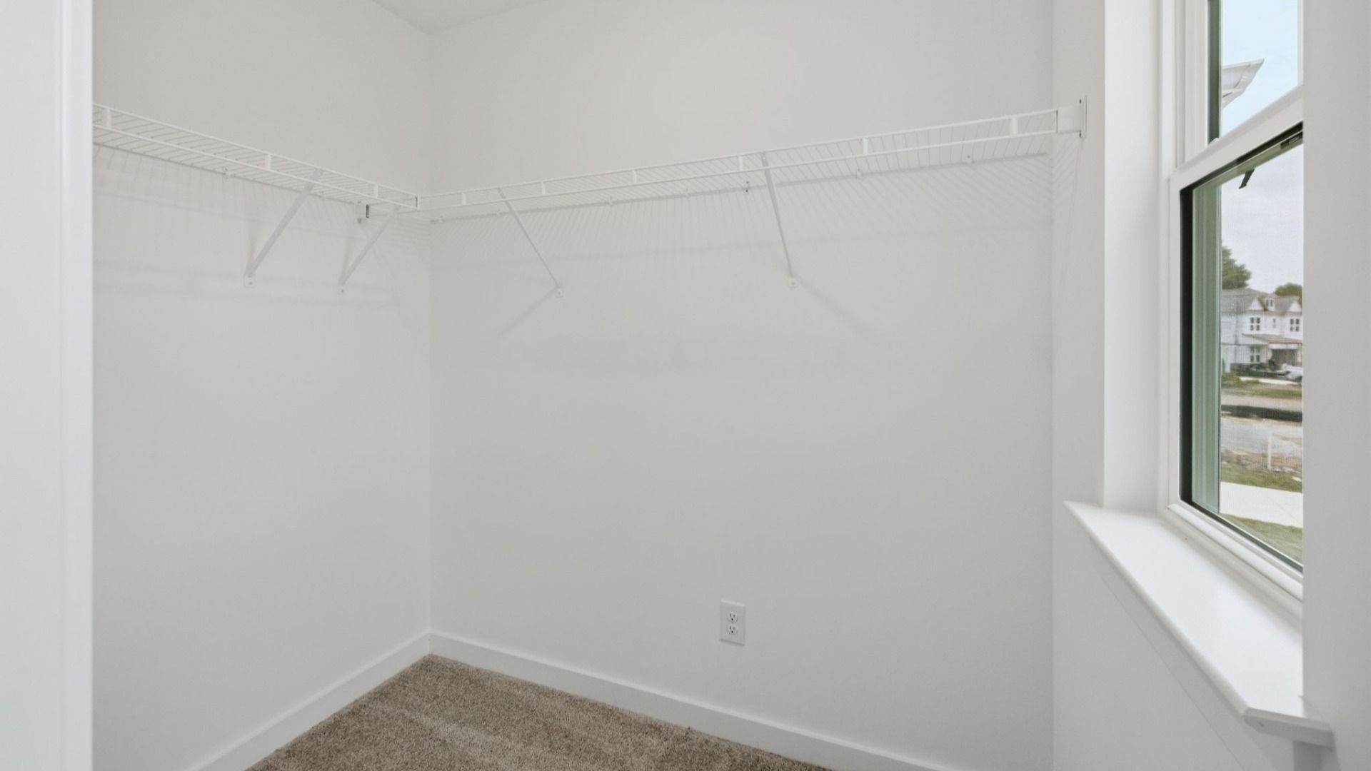 Walk-in closet with ventilated shelf with window