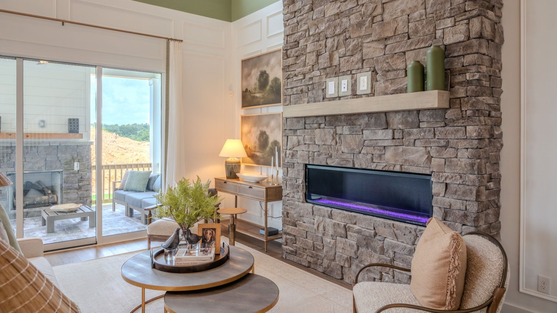 Gathering room with fireplace and access to rear porch