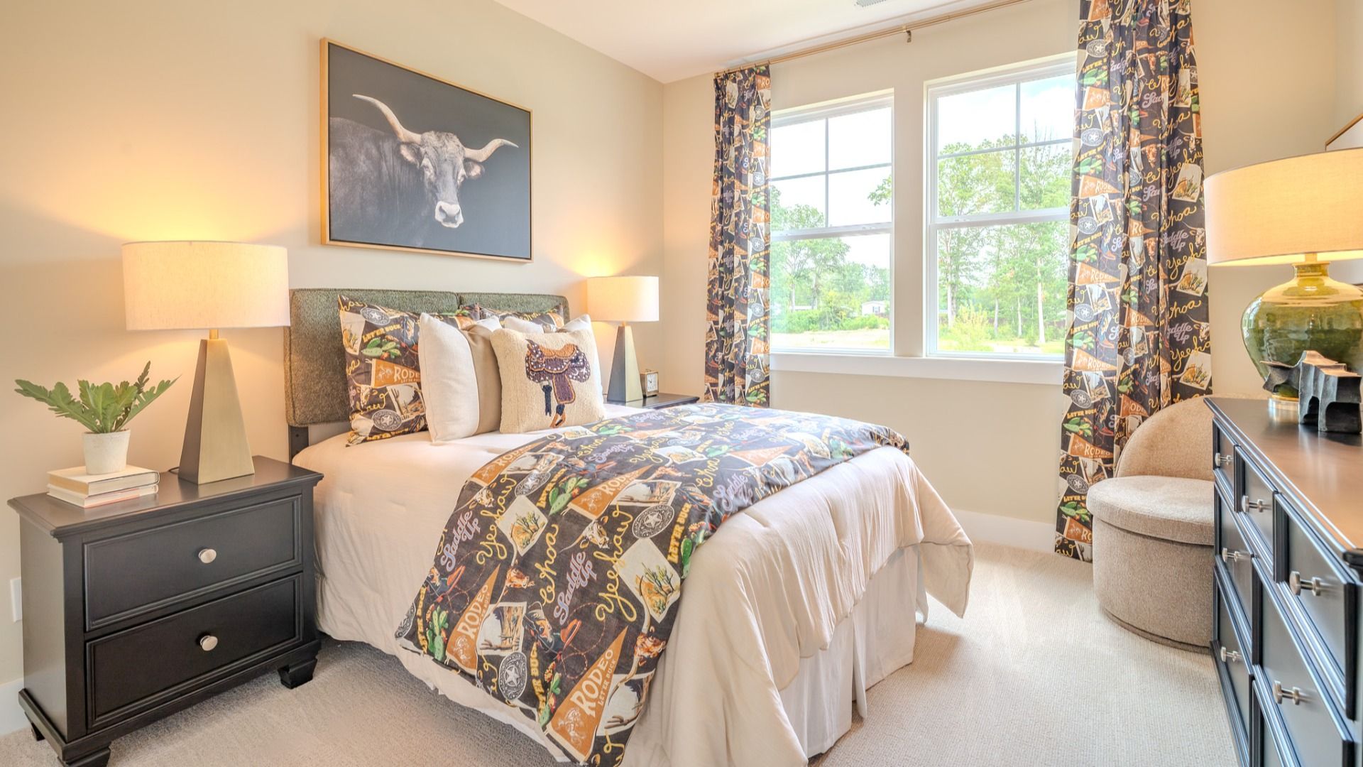 Secondary bedroom with carpet and bright natural light from windows