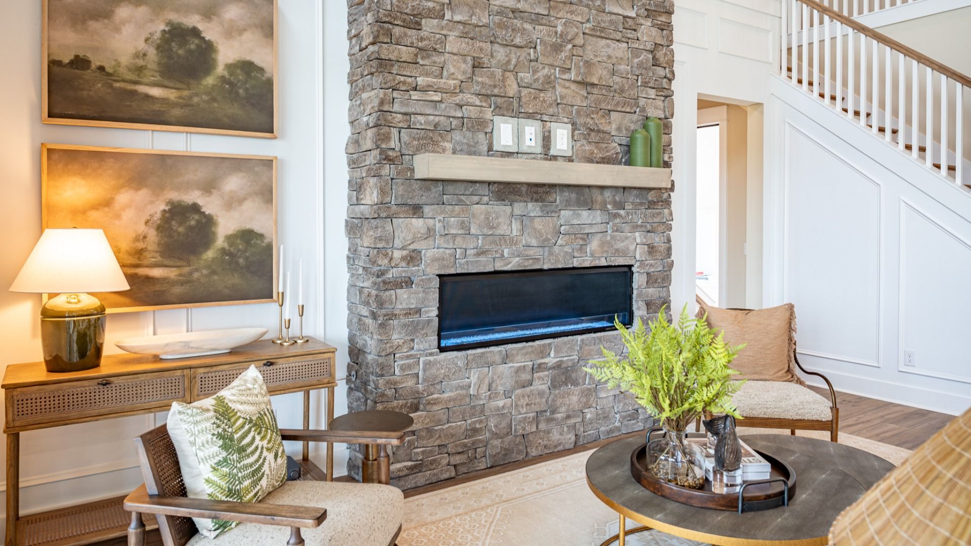 Gathering room with fireplace and access to staircase
