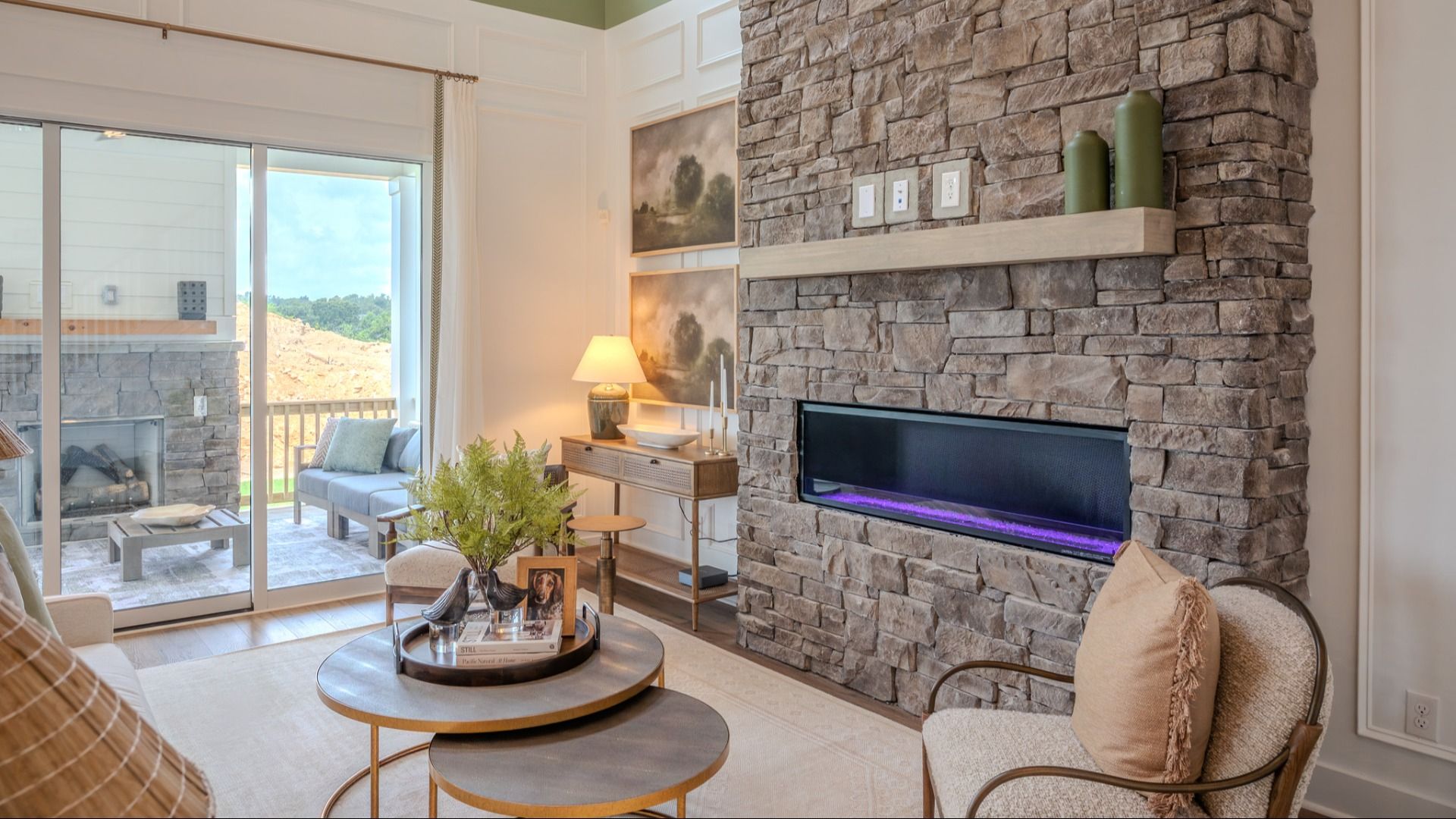 Gathering room with fireplace and access to staircase