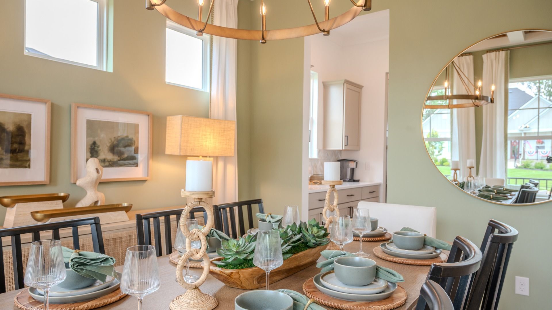 Dining area with coffered ceiling, access to kitchen, and bright natural lighting from windows